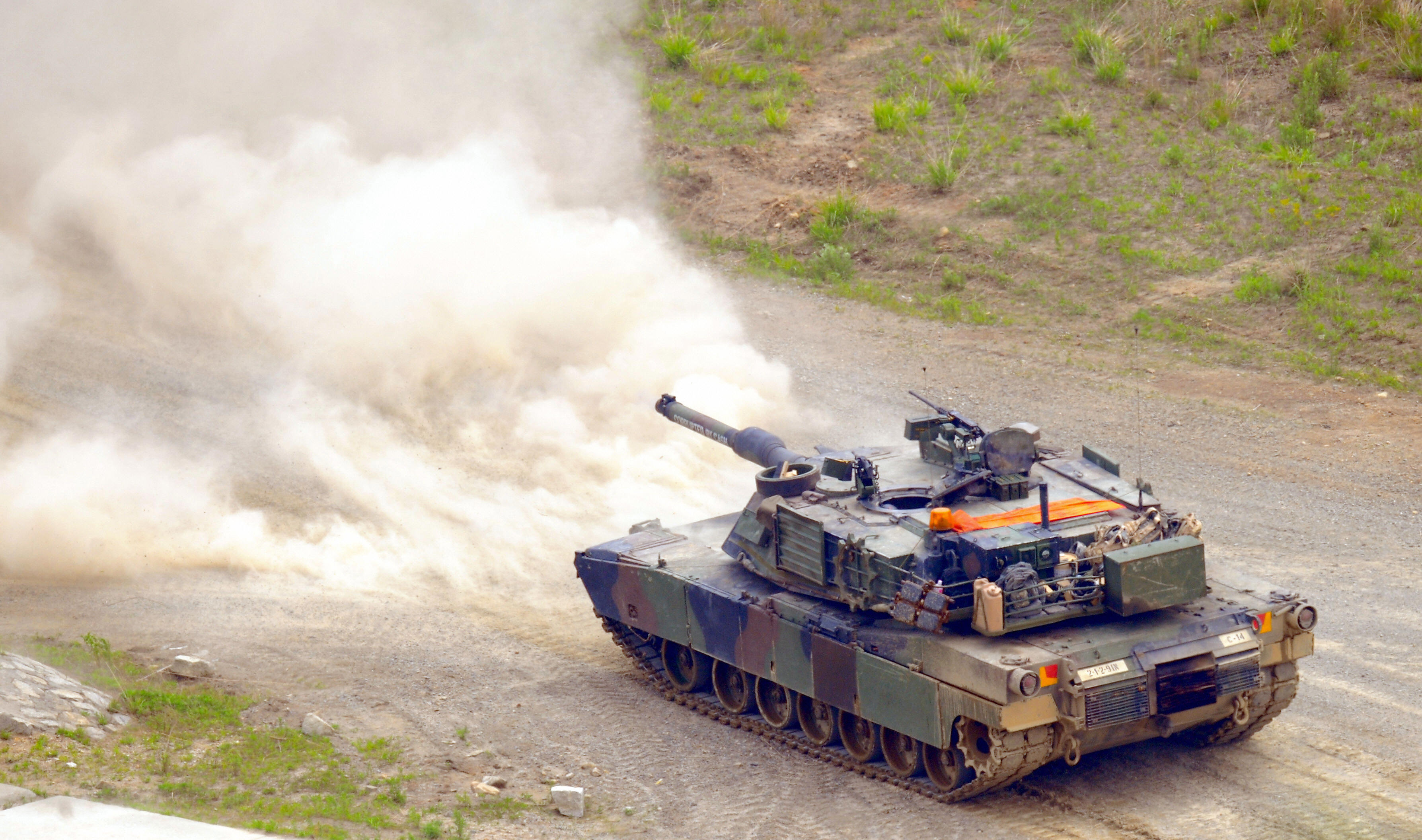 A US M1 tank fires during a joint milita