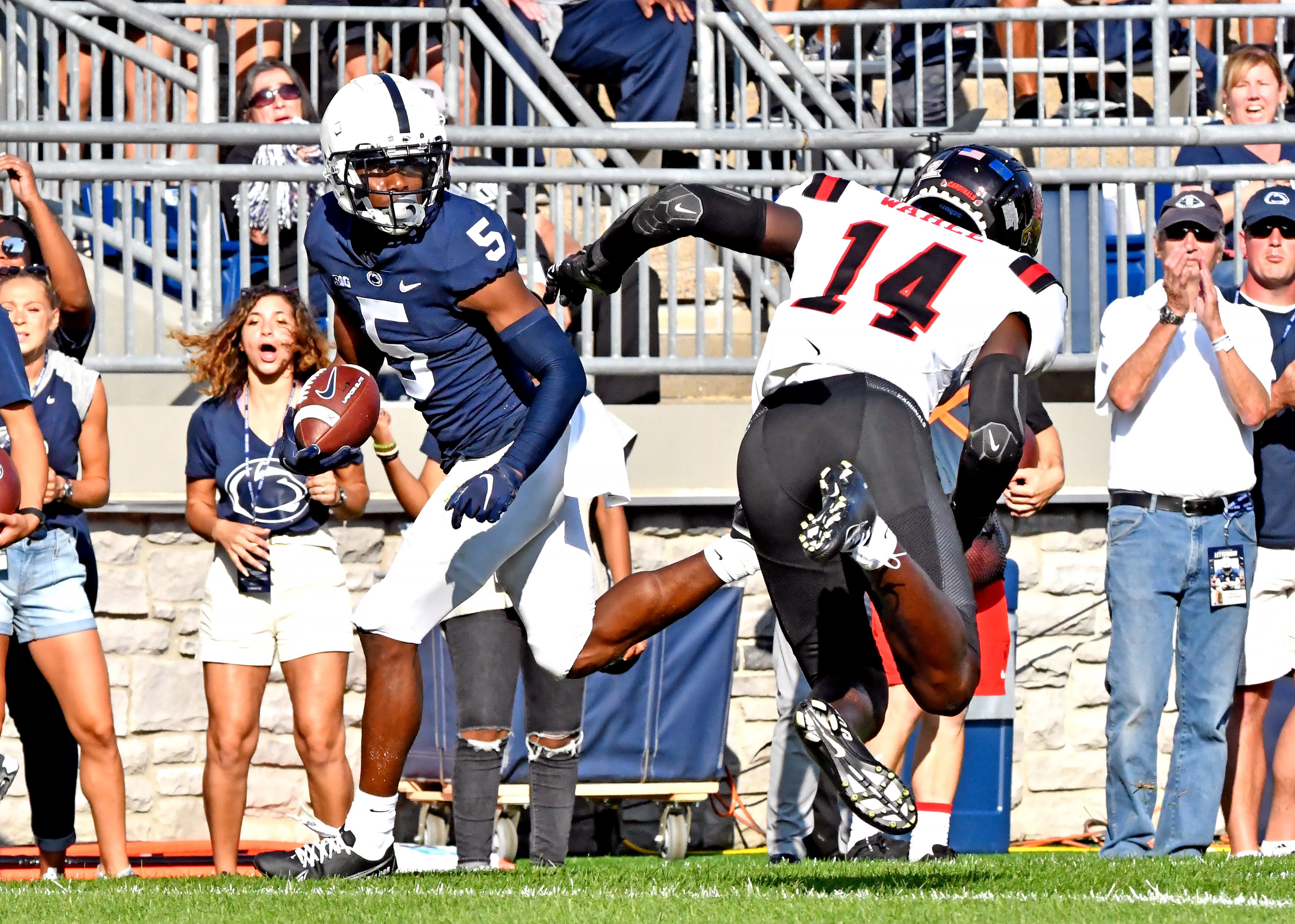 Penn State wide receiver Jahan Dotson runs past defensive backs in a game against Ball State. 