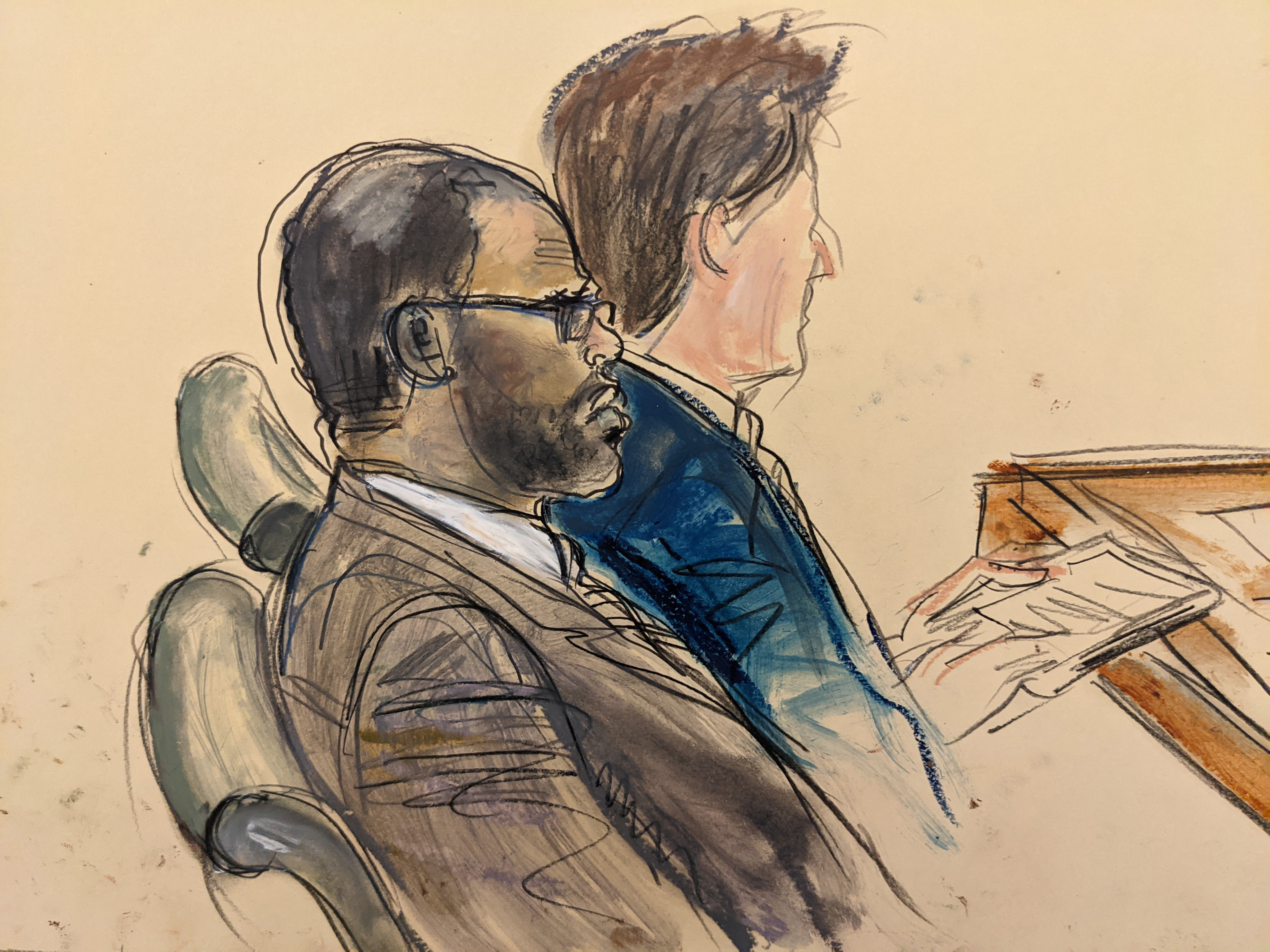 In this courtroom artist’s sketch made from a video screen monitor of a Brooklyn courtroom, defendant R. Kelly, left, listens during the opening day of his trial, Wednesday, Aug. 18, 2021 in New York. The prosecutor described sex abuse claims against Kelly, saying the long-anticipated trial now underway was “about a predator” who used his fame to entice girls, boys and young women before dominating and controlling them physically, sexually and psychologically.