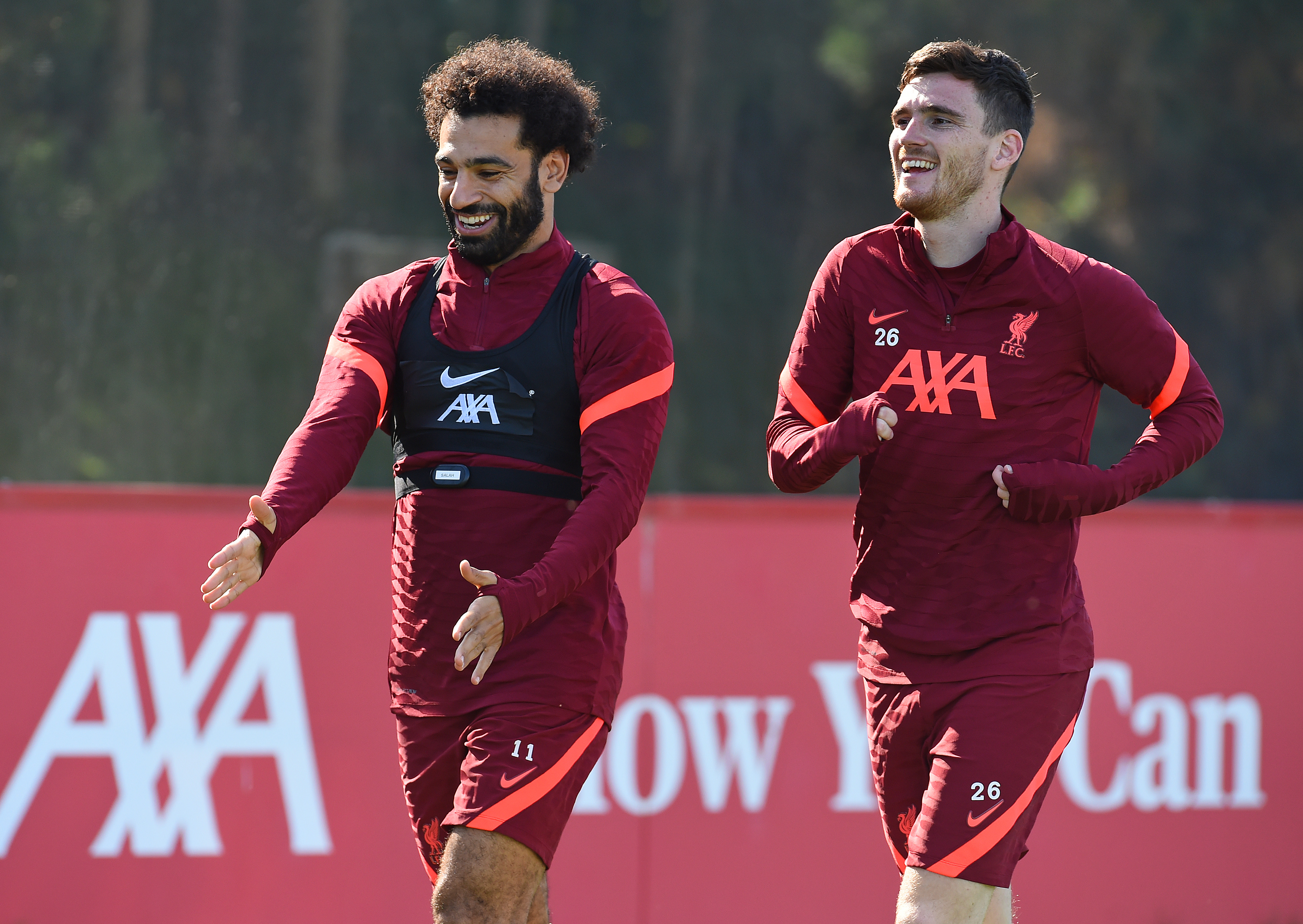 Mohamed Salah and Andy Robertson are all smiles during a training session on September 16, 2021 in Kirkby, England.