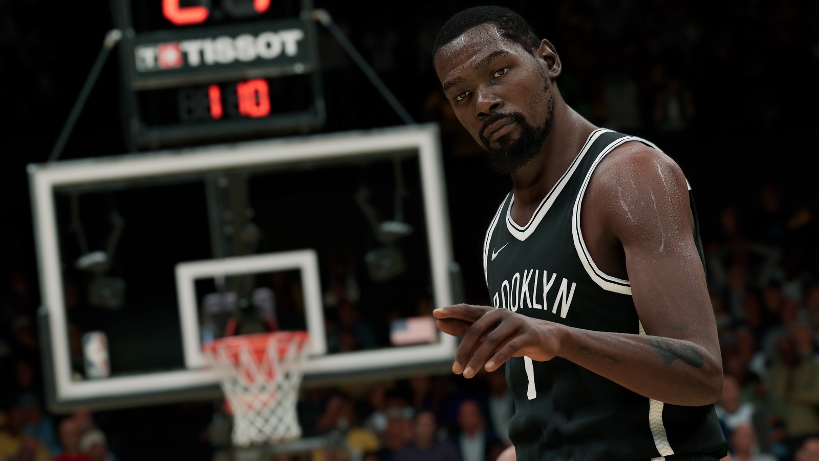 Kevin Durant of the Brooklyn Nets gestures to the camera in front of a basketball goal