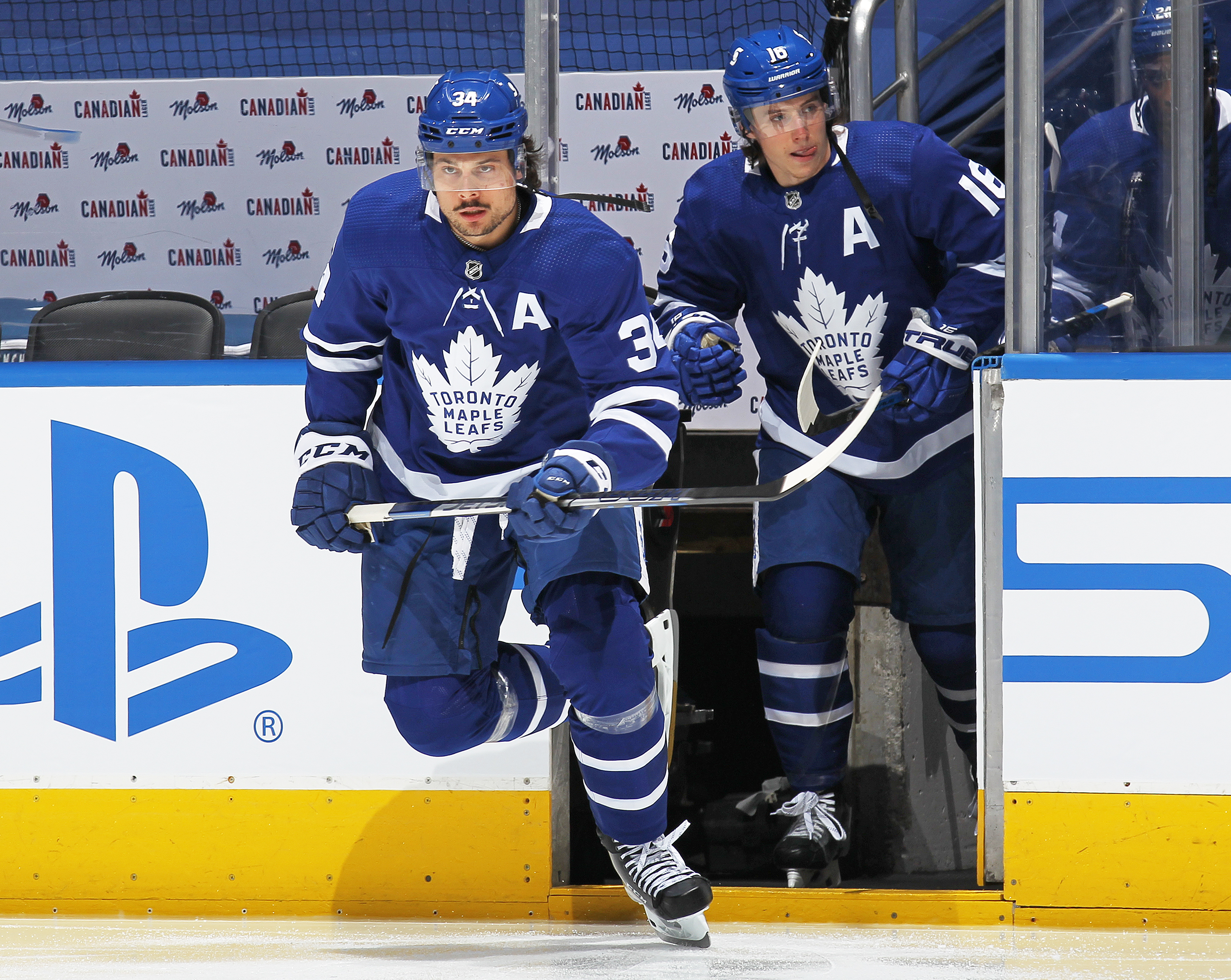 Auston Matthews #34 and Mitchell Marner #16 of the Toronto Maple Leafs take to the ice to play against the Montreal Canadiens in Game 7 of the First Round of the 2021 Stanley Cup Playoffs at Scotiabank Arena on May 31, 2021 in Toronto, Ontario, Canada.