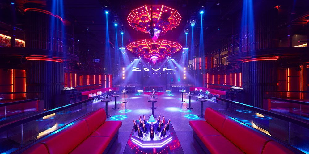 A nightclub with purple and pink lights. 