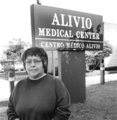 Carmen Velásquez stands outside the Alivio Medical Center