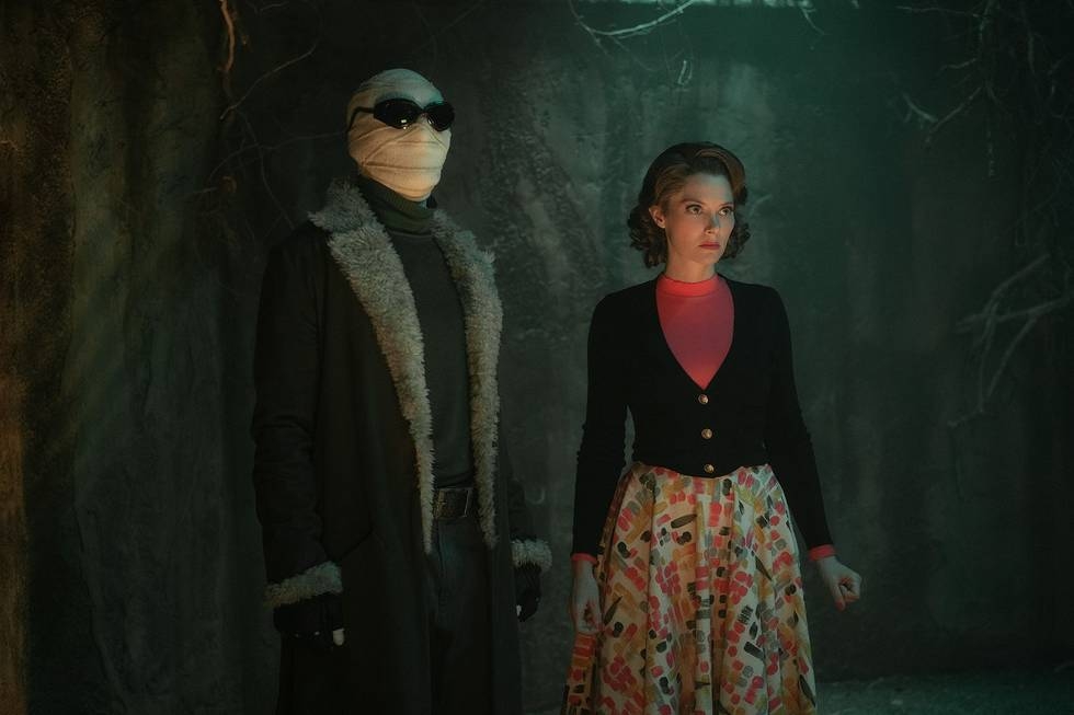Matt Bomer and April Bowlby stand together in the dark in season 3 of Doom Patrol