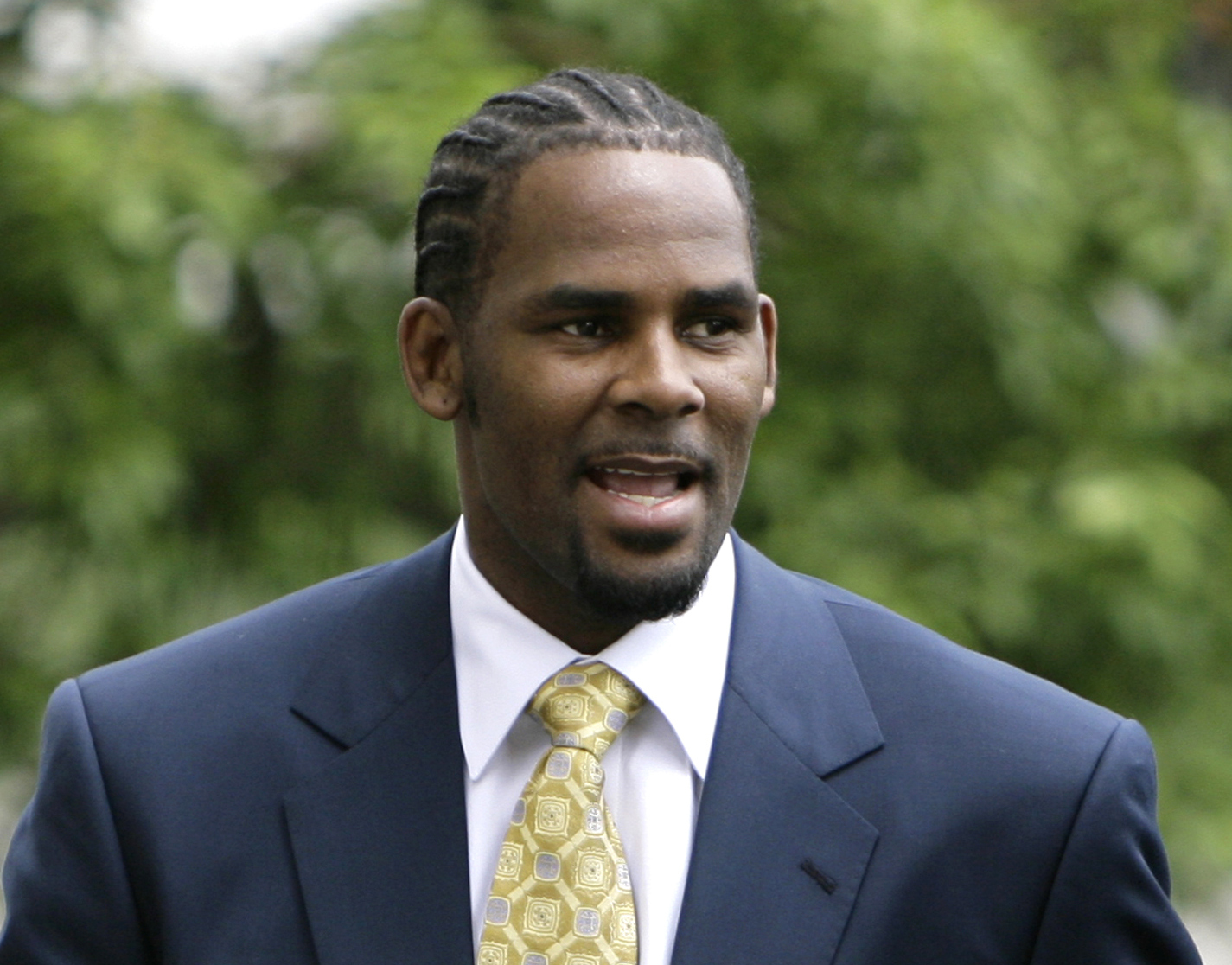 This June 13, 2008 file photo shows R&amp;B singer R. Kelly arriving at the Cook County Criminal Court Building in Chicago. 