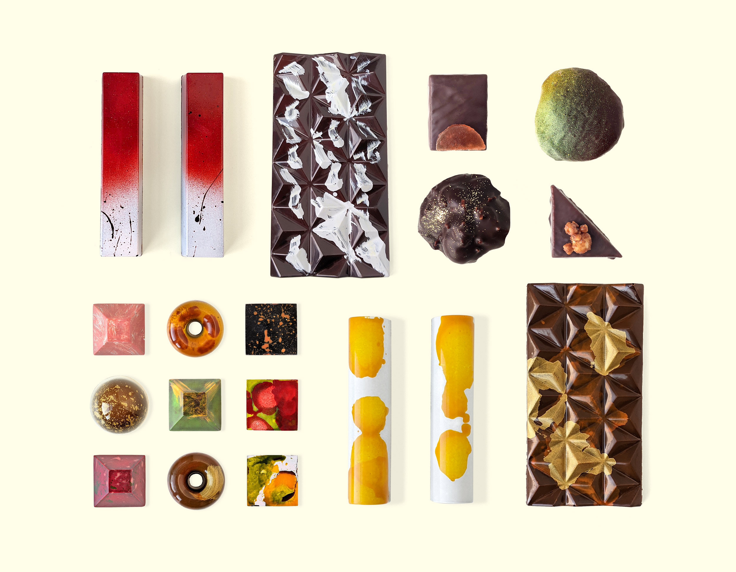 An array of artistic chocolates from Topopgato including bars, squares, doughnut-shaped chocolates and more.