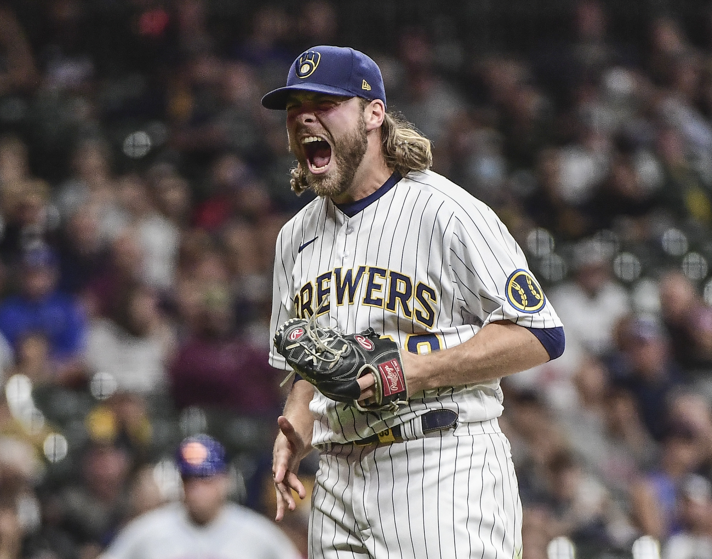 Milwaukee Brewers pitcher Corbin Burnes (39) reacts after retiring the side in the seventh inning during the game against the New York Mets at American Family Field.