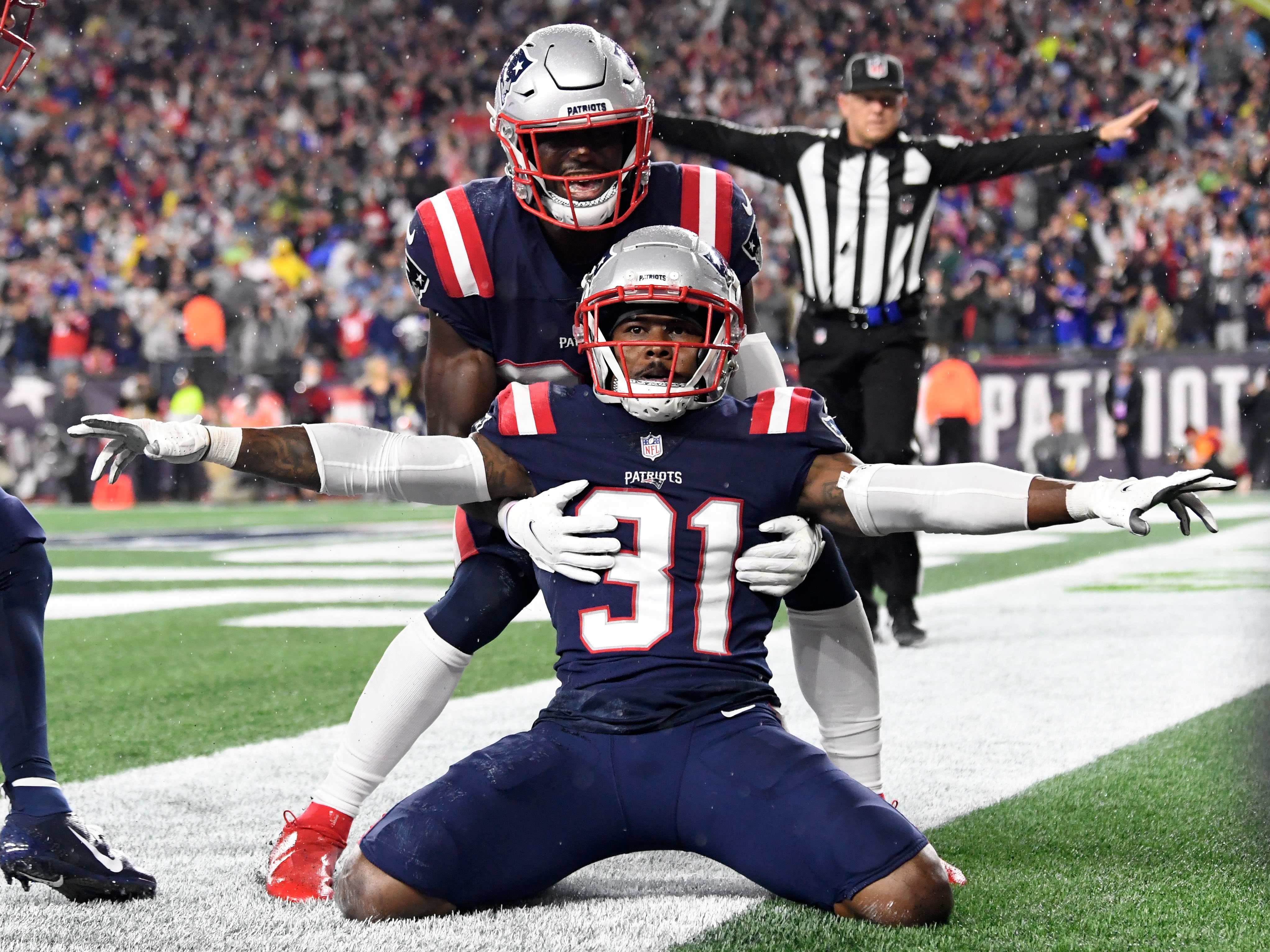 New England Patriots free safety Devin McCourty (32) celebrates with defensive back Jonathan Jones (31) after breaking up a pass in the end zone during the second half of a game against the Tampa Bay Buccaneers at Gillette Stadium.&nbsp;