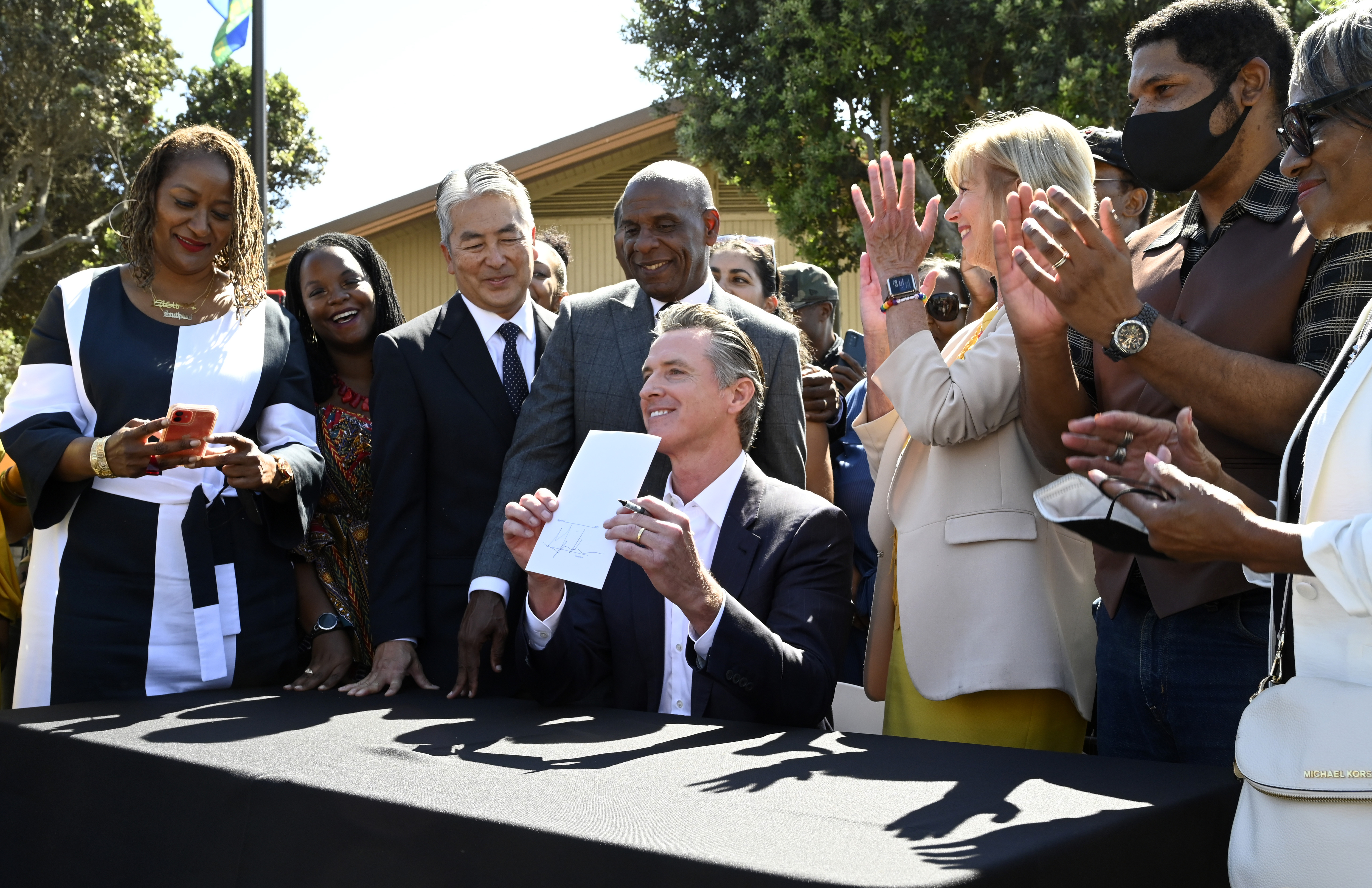 Governor Gavin Newsom signs SB 796 returning Manhattan Beach land to the Bruce family.