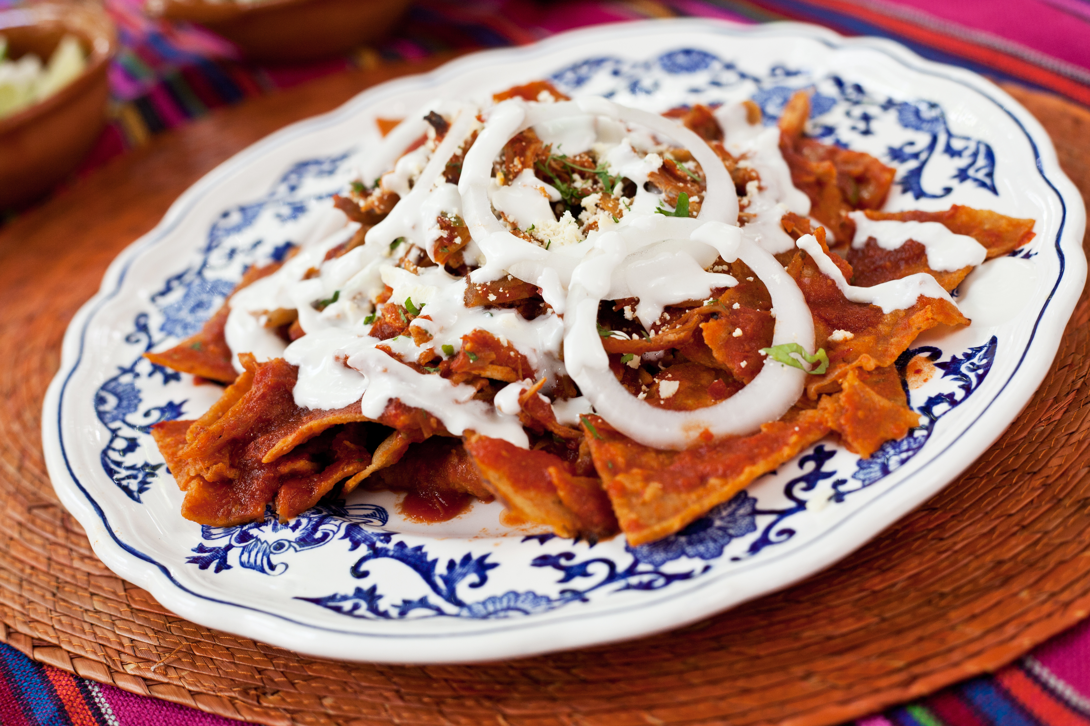 A plate of chilaquiles on round vessel. 