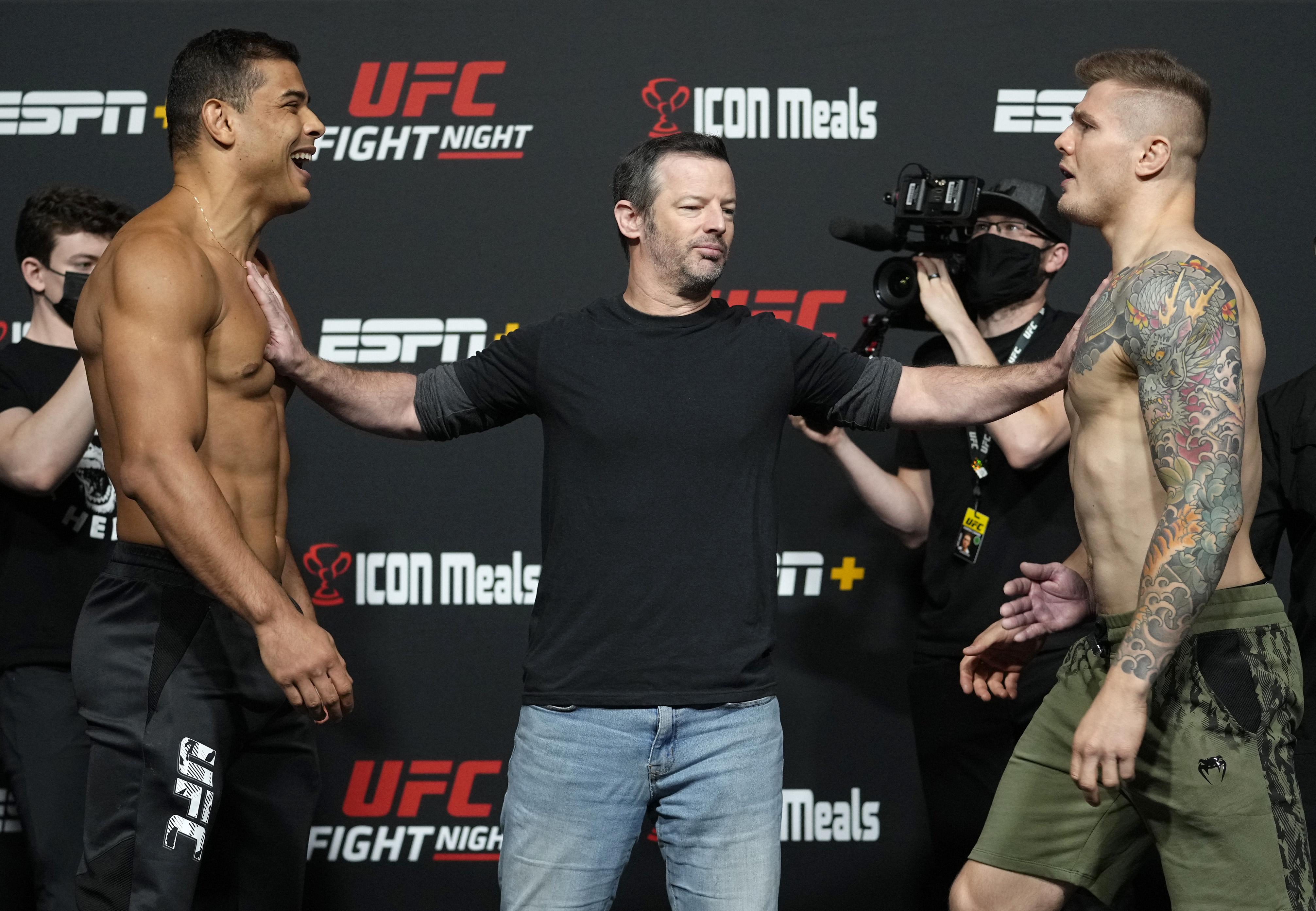 Paulo Costa and Marvin Vettori being separated at the UFC Vegas 41 weigh-ins. 