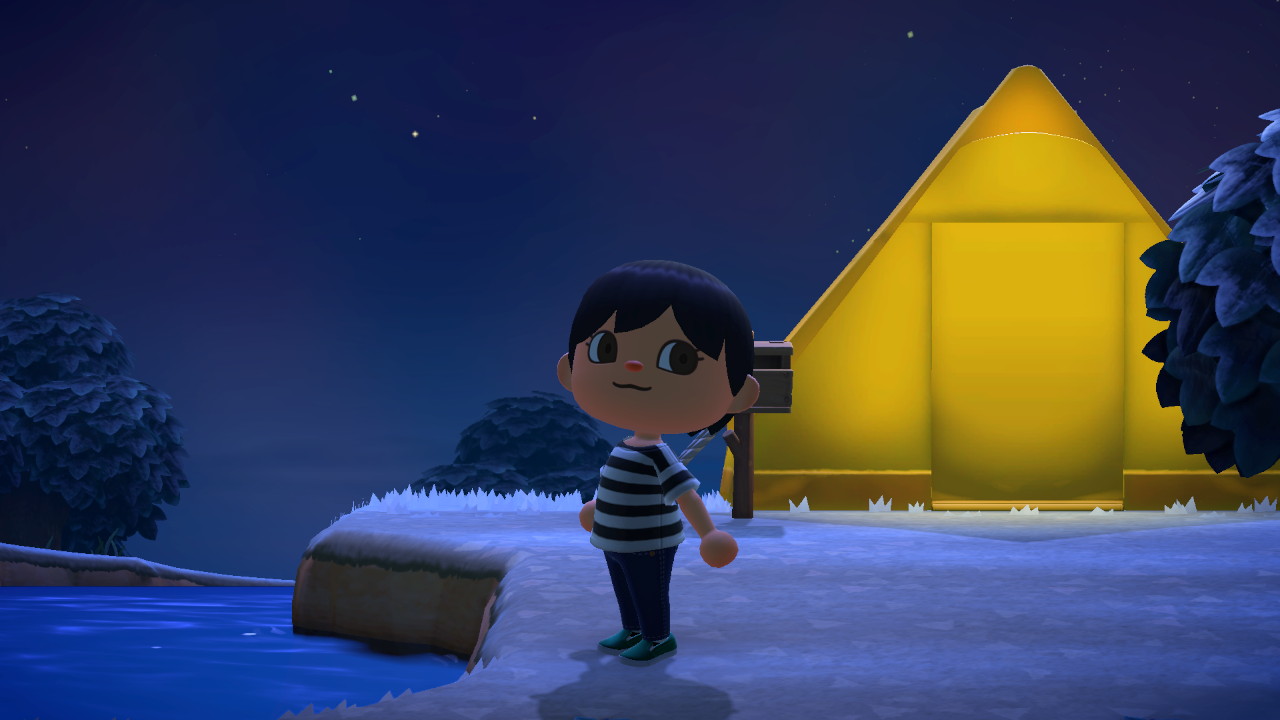 A short-haired villager stands in front of a yellow tent at night