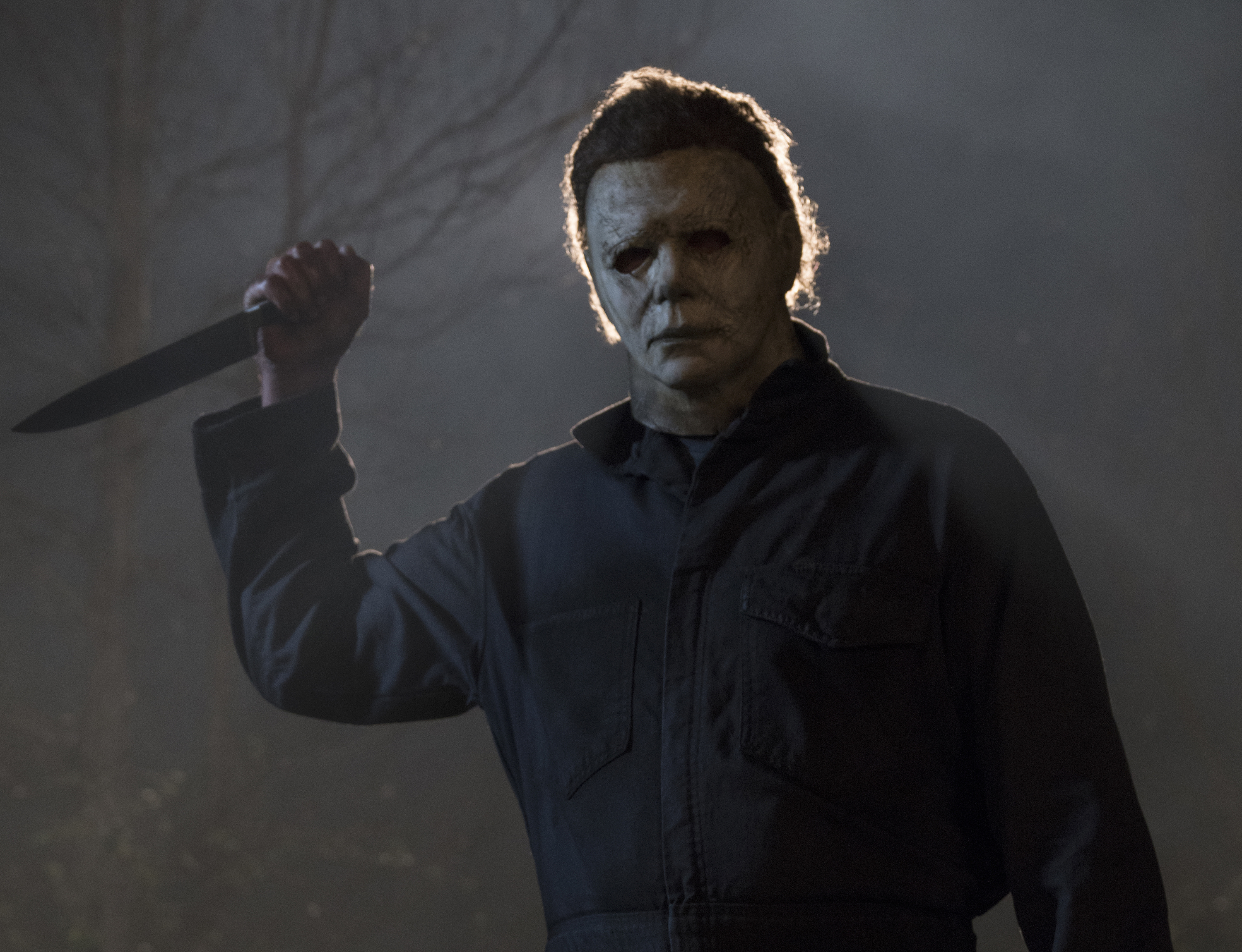 Michael Myers holds a knife menacingly in his white mask in 2018’s Halloween.