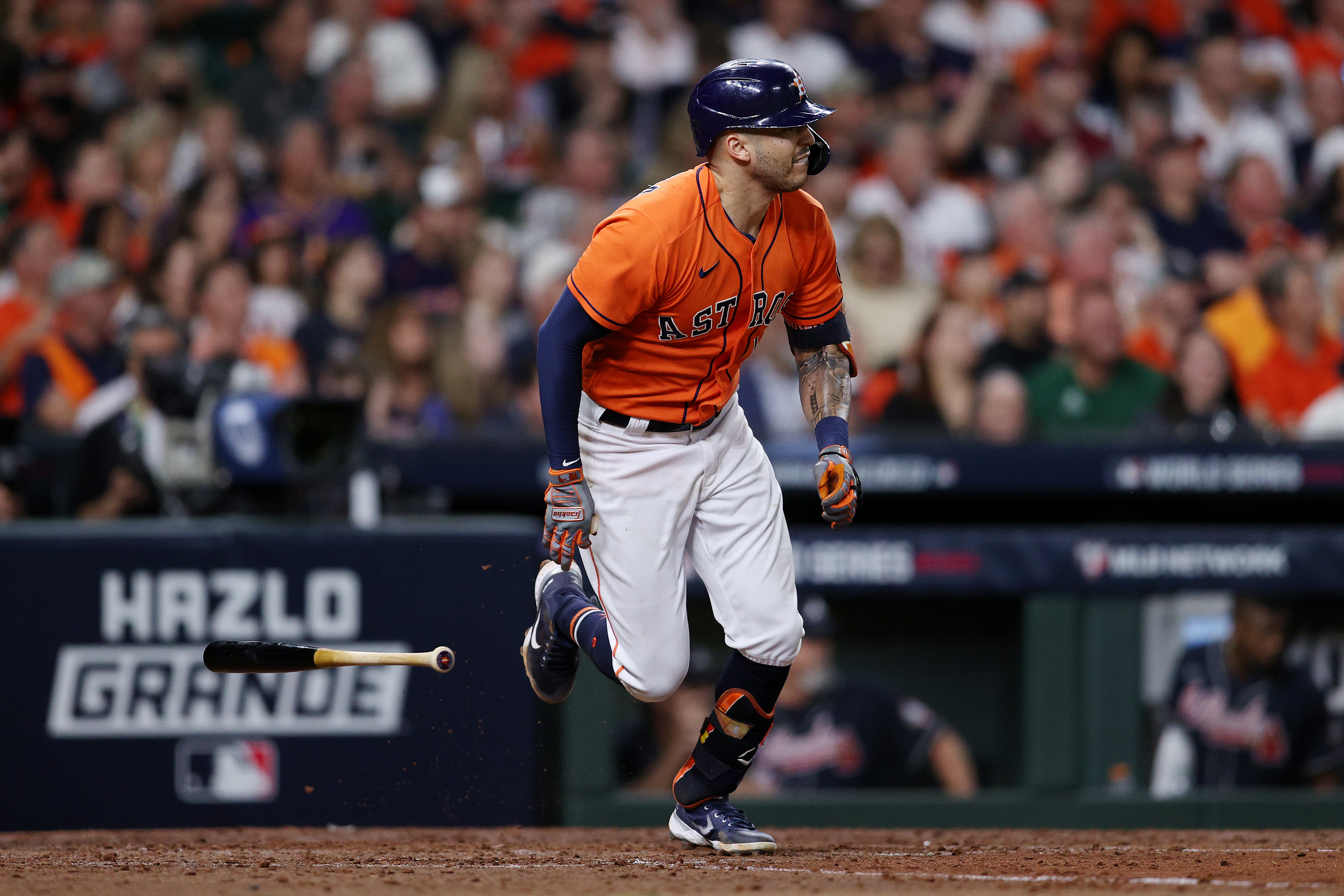 Carlos Correa #1 of the Houston Astros hits a single against the Atlanta Braves during the sixth inning in Game Two of the World Series at Minute Maid Park on October 27, 2021 in Houston, Texas.