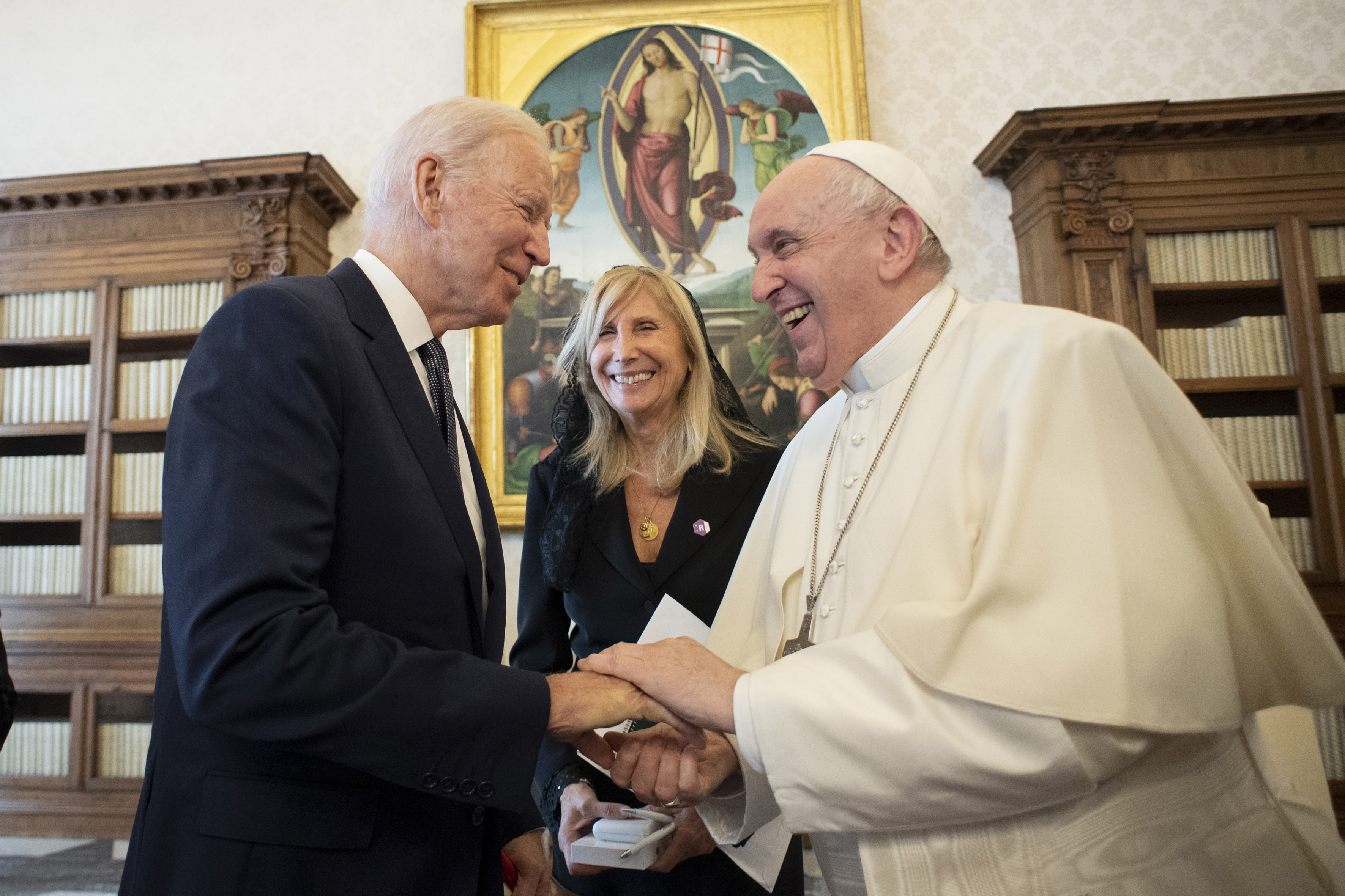 US President Joe Biden, left, shakes hands with Pope Francis as they meet at the Vatican, Friday, Oct. 29, 2021. President Joe Biden is set to meet with Pope Francis on Friday at the Vatican, where the world’s two most notable Roman Catholics plan to discuss the COVID-19 pandemic, climate change and poverty. The president takes pride in his Catholic faith, using it as moral guidepost to shape many of his social and economic policies. 