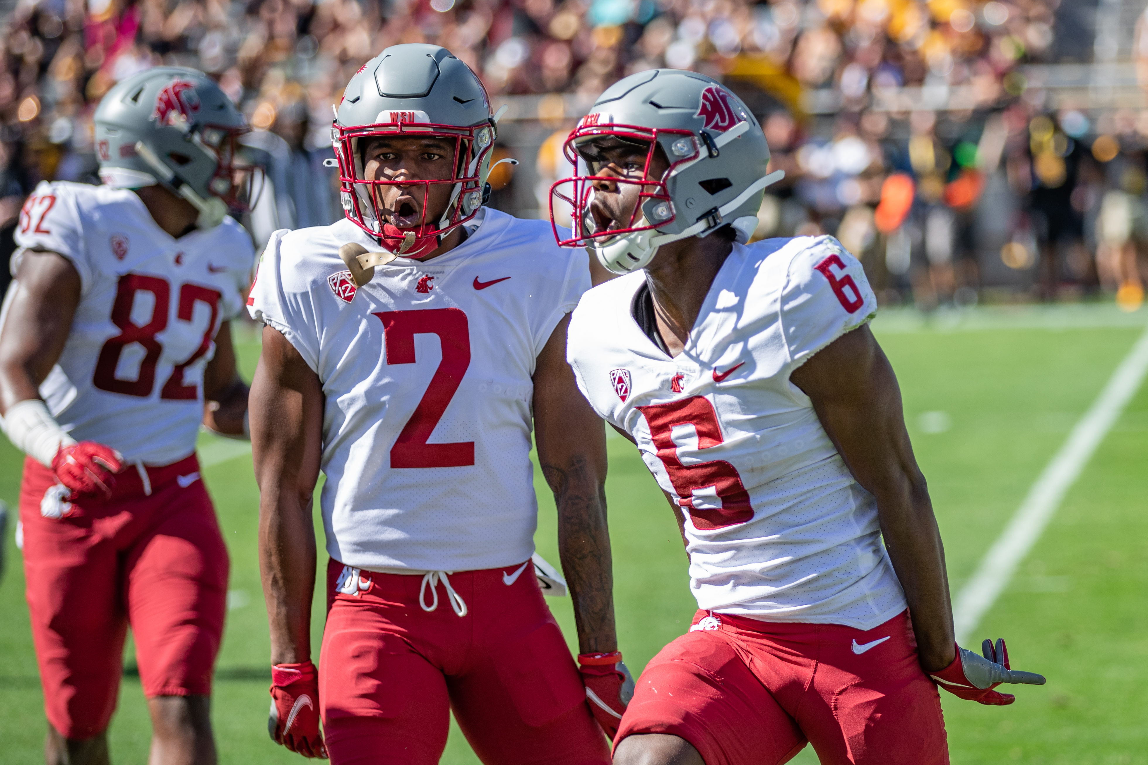 TEMPE, AZ - OCTOBER 30: Washington State cornerback Chris Jackson (2) and Chau Smith-Wade (6) celebrate an interception during the first half of a PAC 12 conference matchup between the Arizona State Sun Devils and the Washington State Cougars on October 30, 2021, at Sun Devil Stadium in Tempe, AZ.