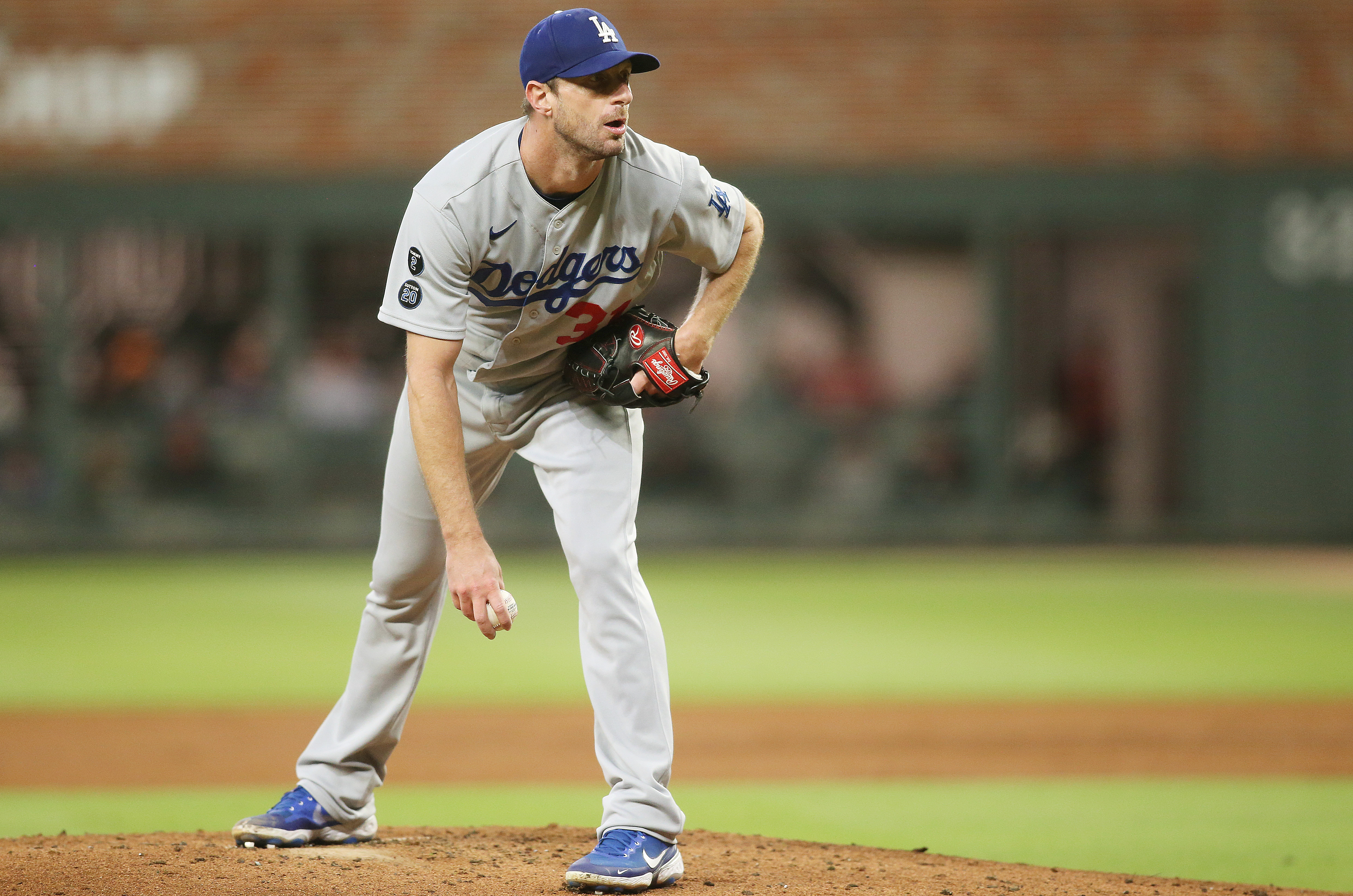 Los Angeles Dodgers starting pitcher Max Scherzer (31) looks for the pitch against the Atlanta Braves during the second inning in game two of the 2021 NLCS at Truist Park.