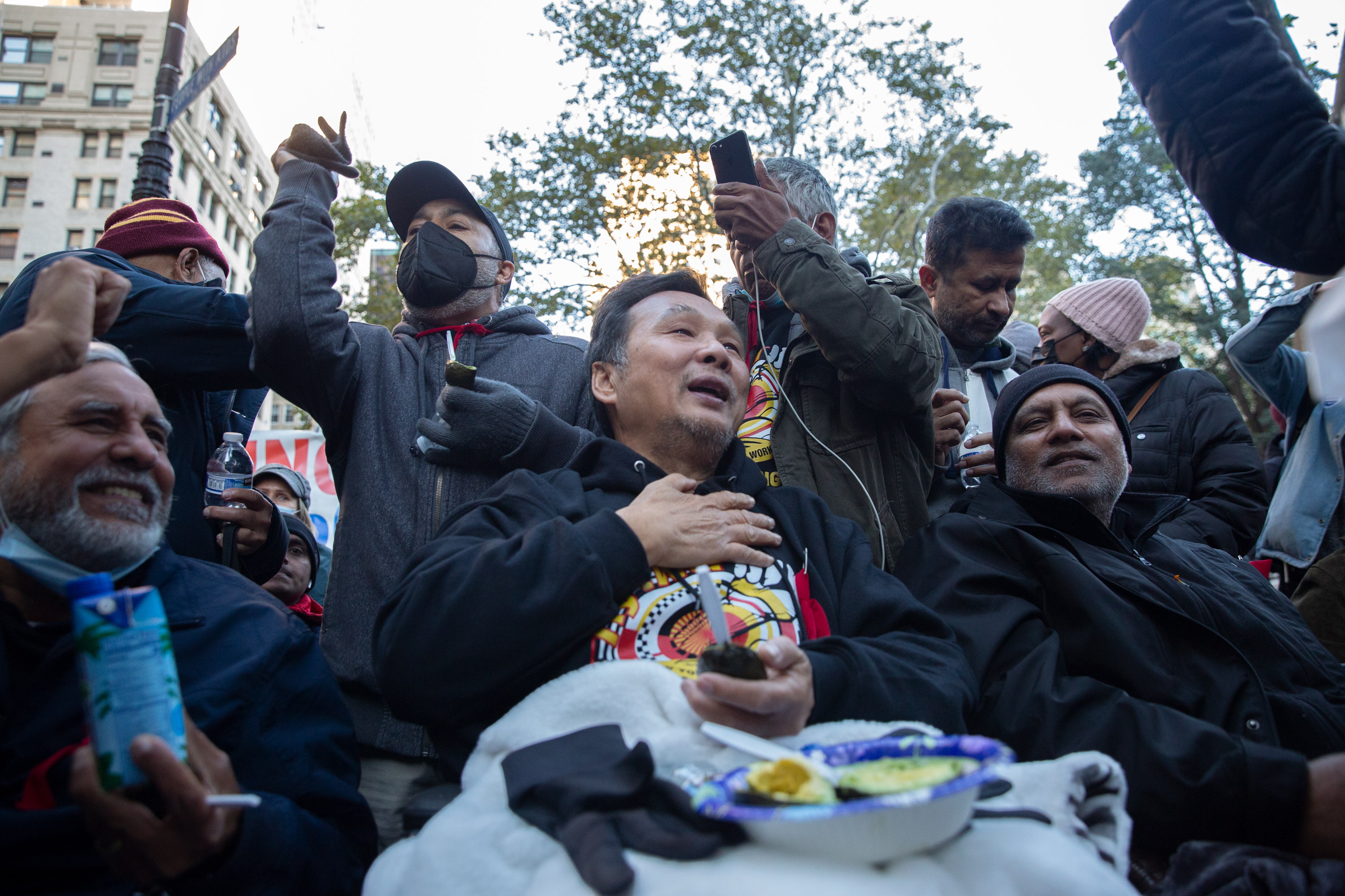 Taxi workers celebrate ending their hunger strike outside City Hall after gaining concessions on their medallion debt, Nov. 3, 2021.
