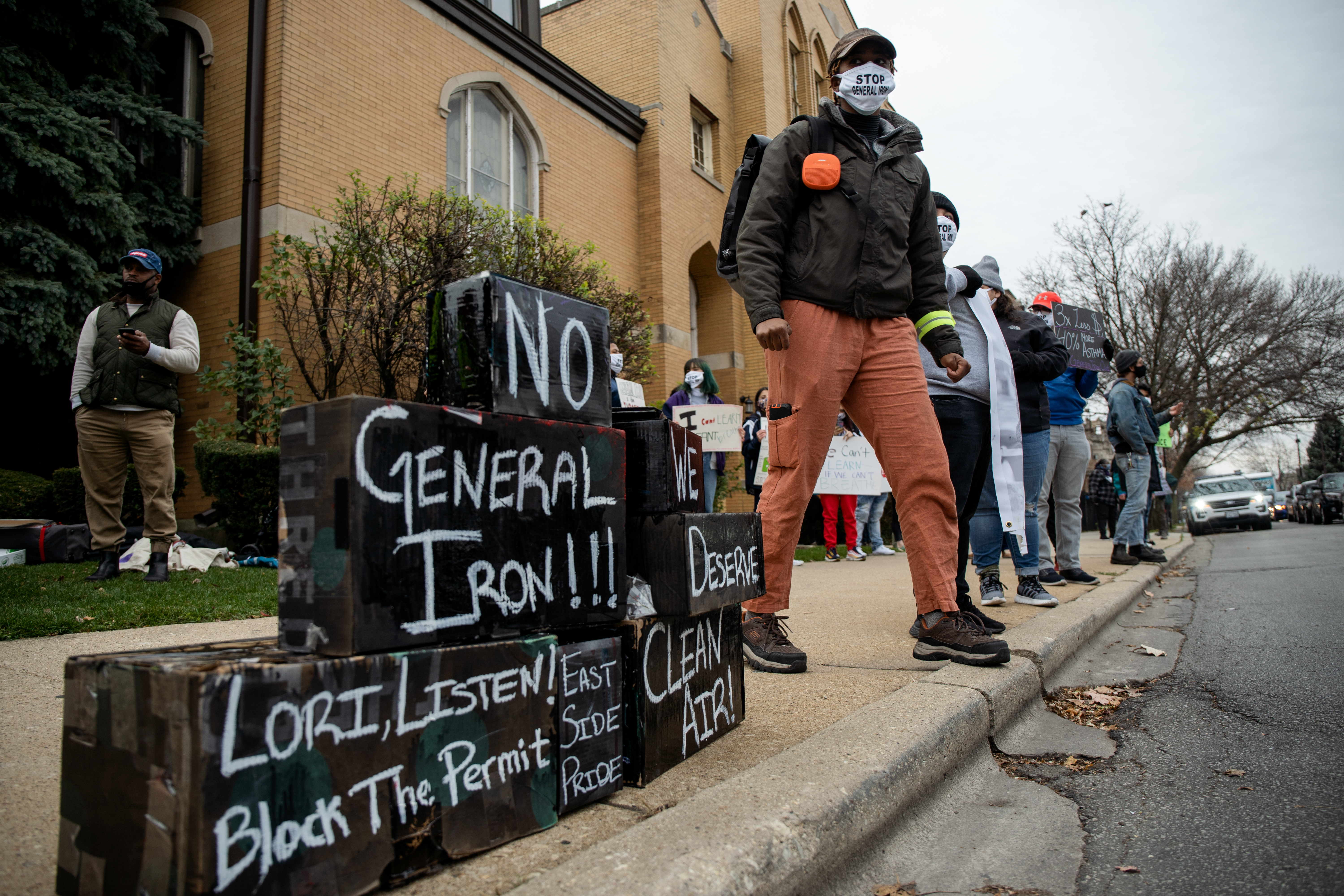 A protester attends a rally near Mayor Lori Lightfoot’s home last year urging her to deny the final permit for a Southeast Side scrap-metal operation.