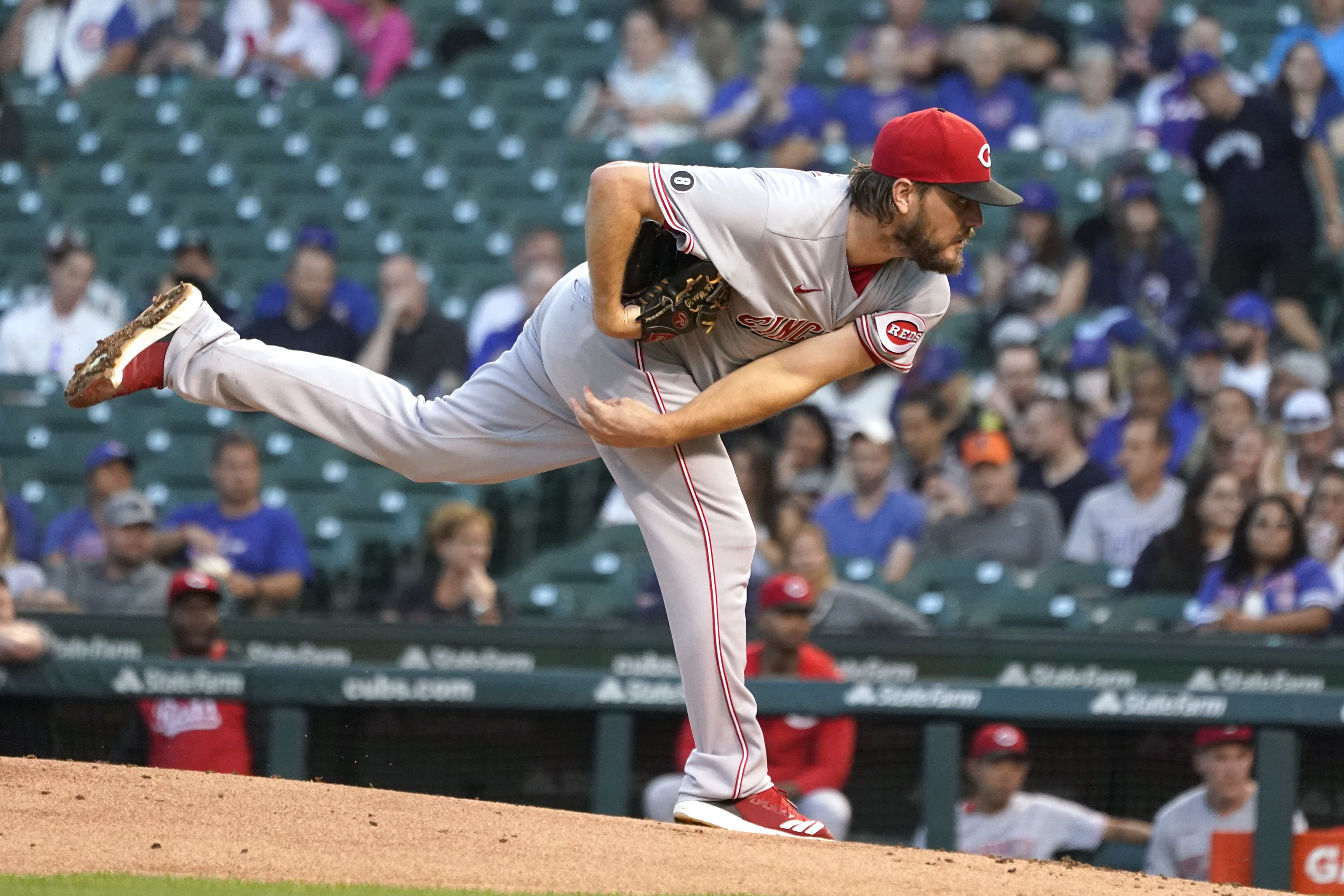 Cincinnati Reds starting pitcher Wade Miley watches a throw during the first inning of the team’s baseball game against the Chicago Cubs on Tuesday, Sept. 7, 2021, in Chicago. (AP Photo/Charles Rex Arbogast) ORG XMIT: CXC101