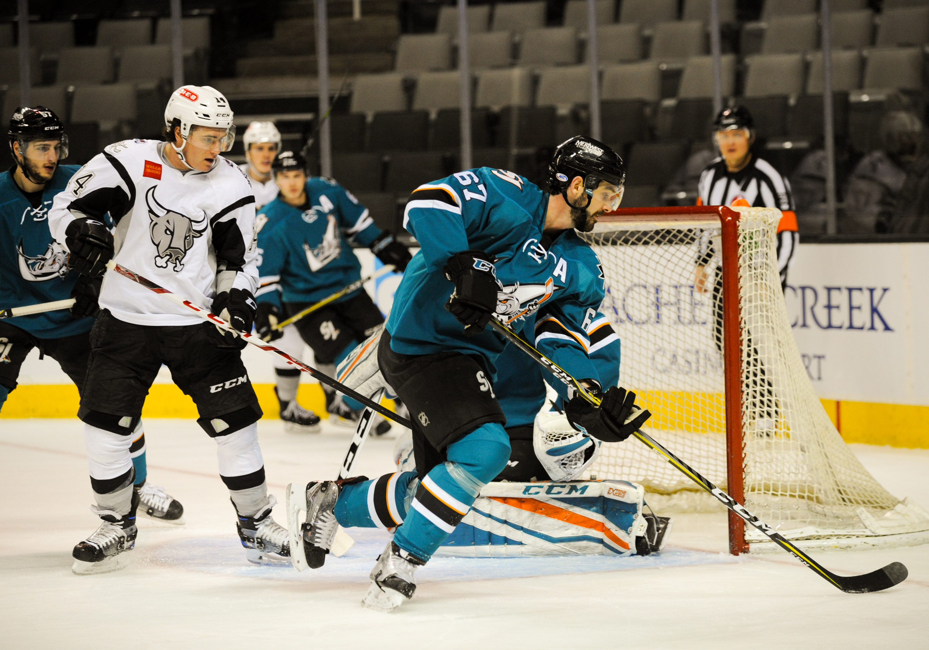 San Jose Barracuda defenseman Jacob Middleton (67) skates with the puck to draw the defending player away from the net during the regular season game between the San Jose Barracuda and the San Antonio Rampage on January 9, 2017 at SAP Center in San Jose, CA&nbsp;