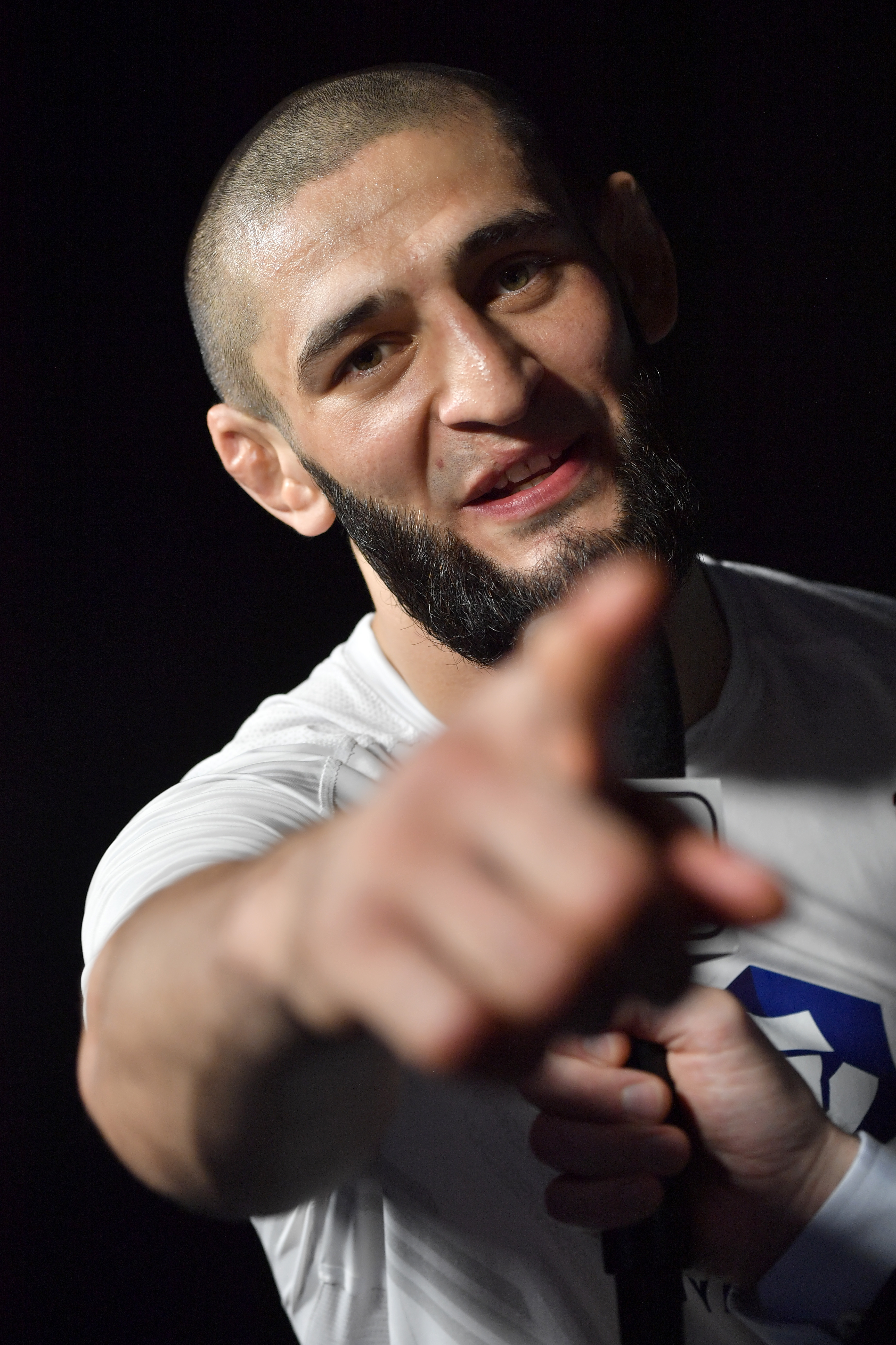 Khamzat Chimaev points at the camera after defeating Li Jingliang at UFC 267.