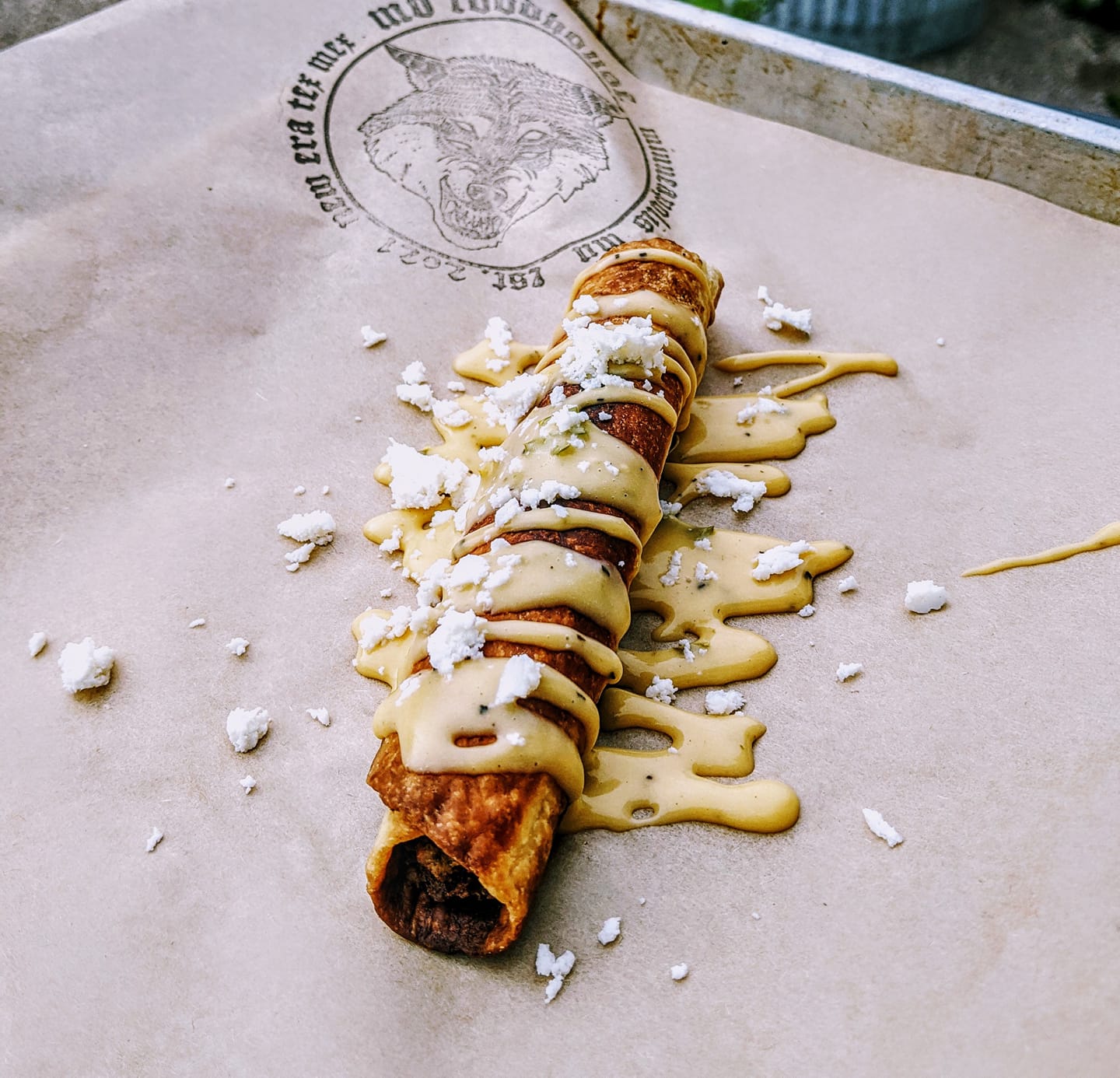 MB Foodhouse’s taquito drizzled in roasted poblano garlic crema.
