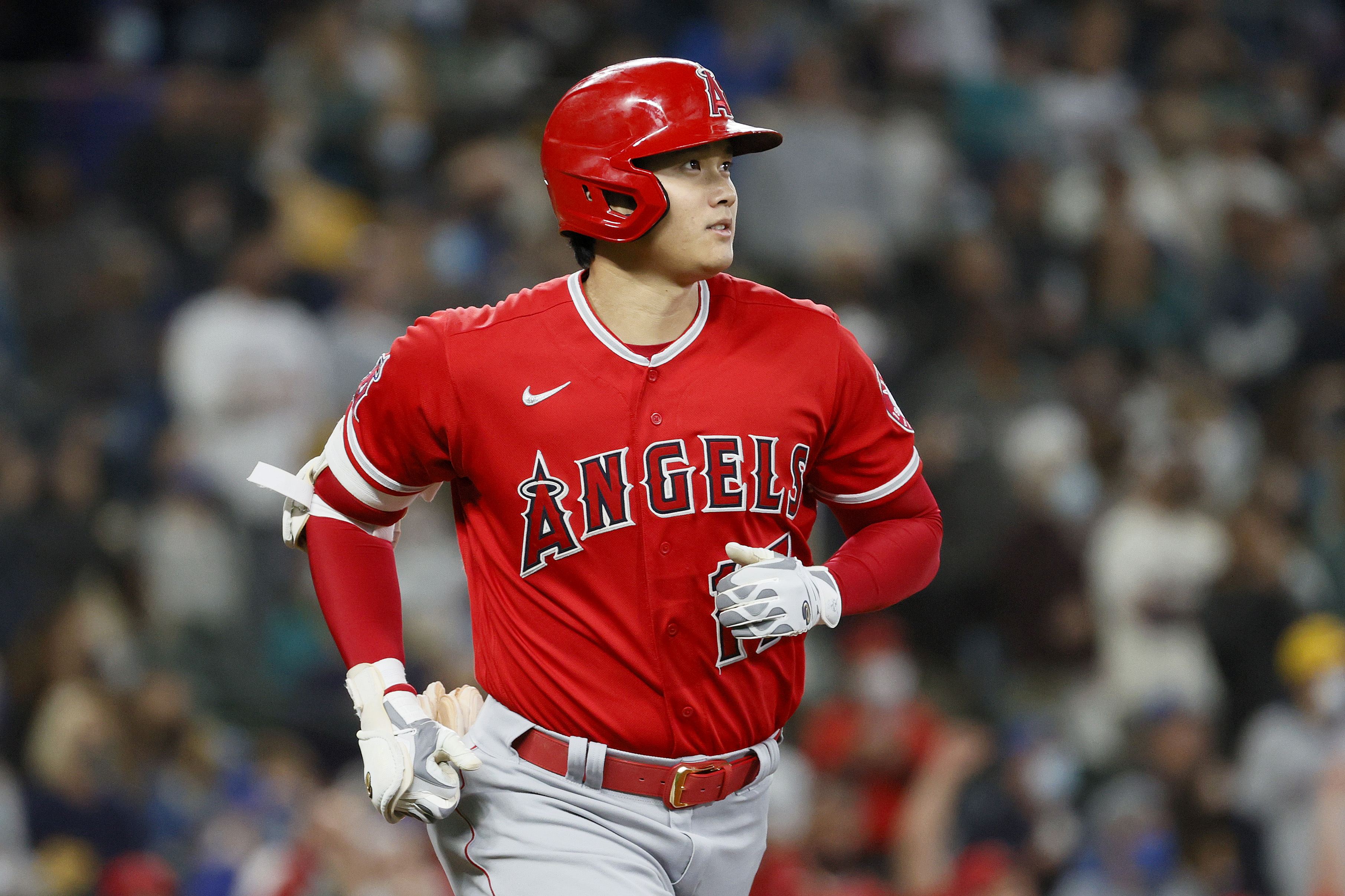 Shohei Ohtani #17 of the Los Angeles Angels watches his home run against the Seattle Mariners during the first inning at T-Mobile Park on October 03, 2021 in Seattle, Washington.