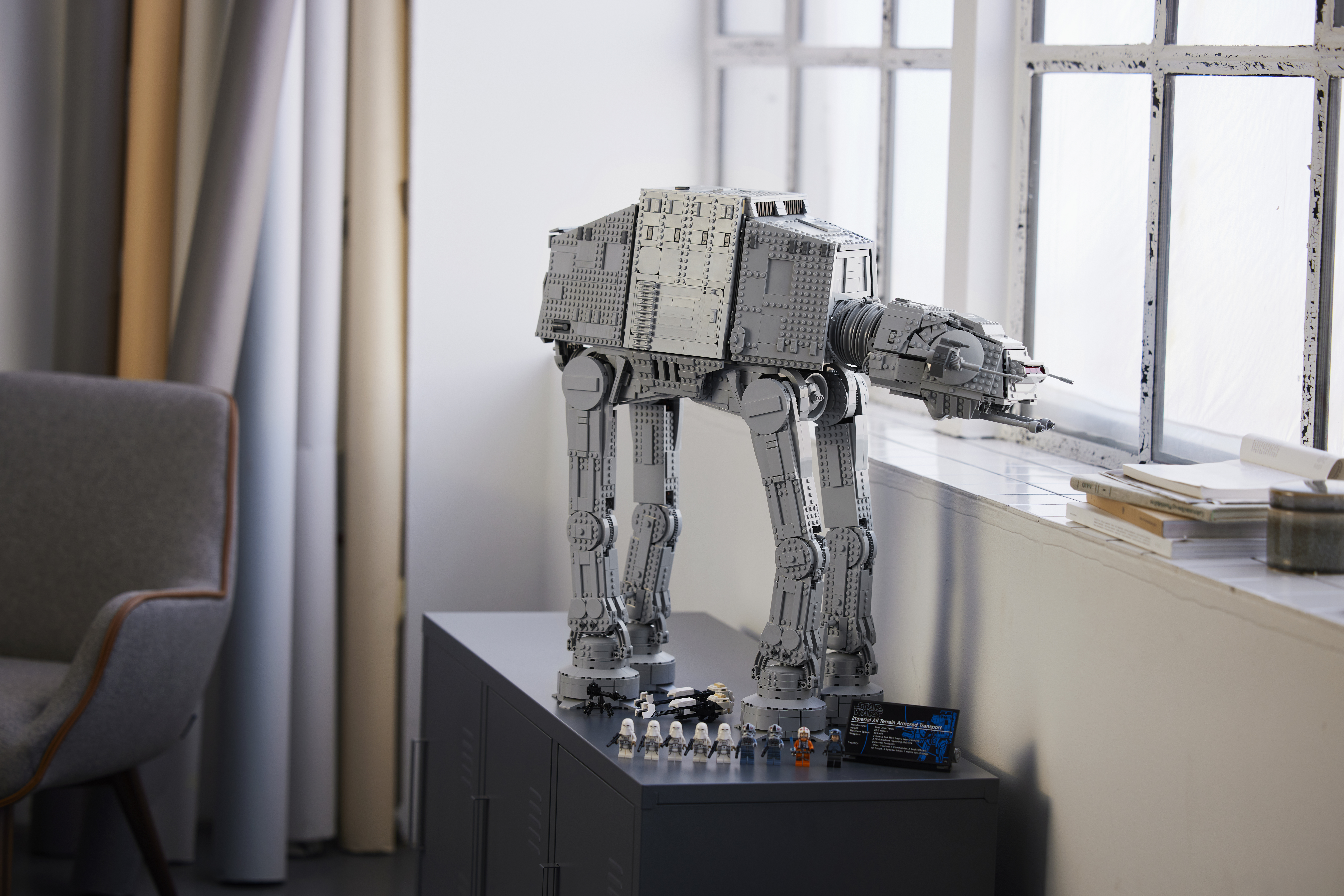 a lego AT-AT on a shelf