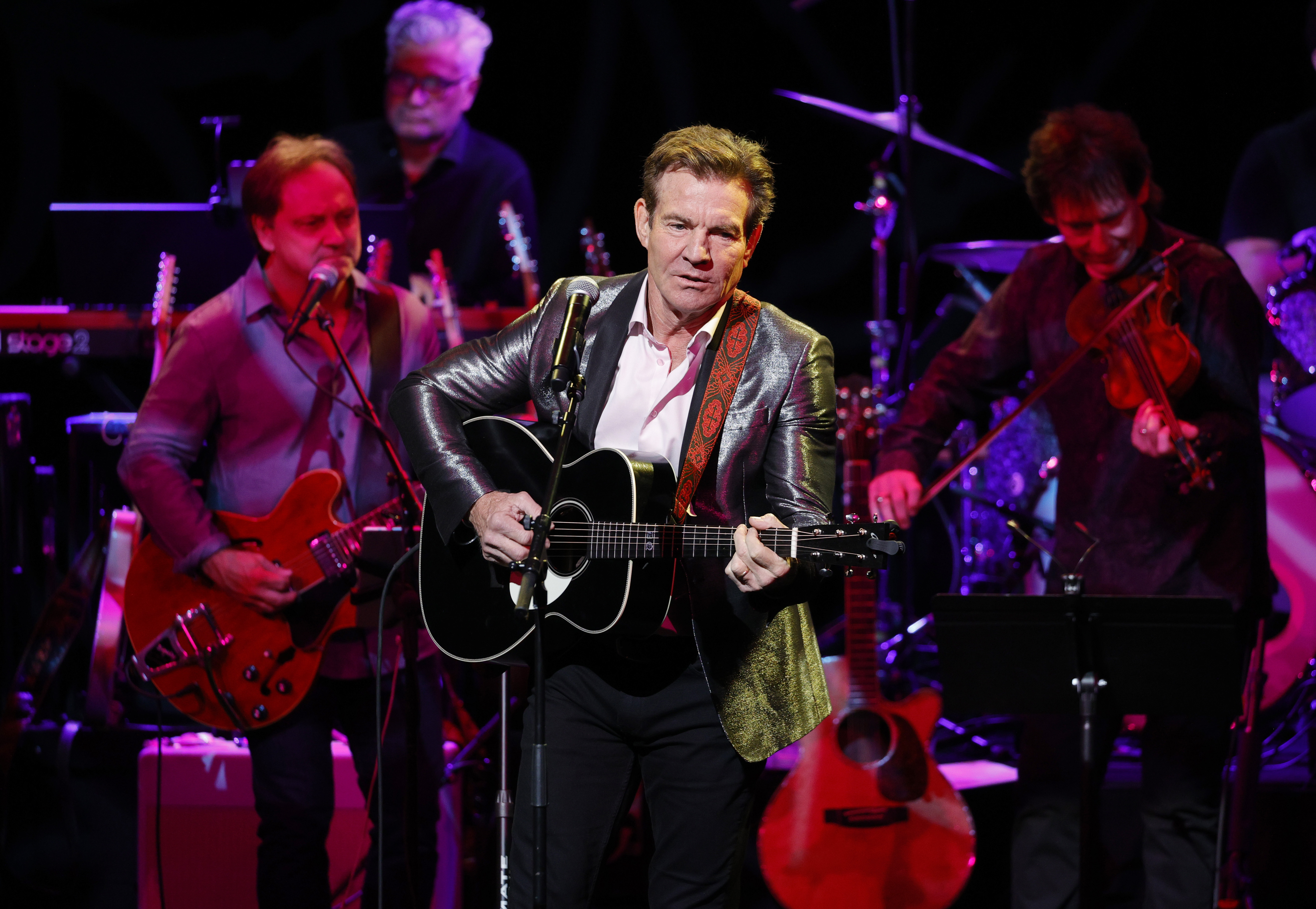    Dennis Quaid performs a at the Country Music Hall of Fame and Museum on Oct. 24, 2021 in Nashville, Tennessee. Quaid brings his solo evening of music to City Winery Chicago on Nov. 10.  