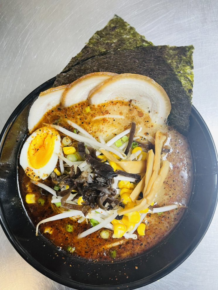 ramen bowl with egg, noodles, corn