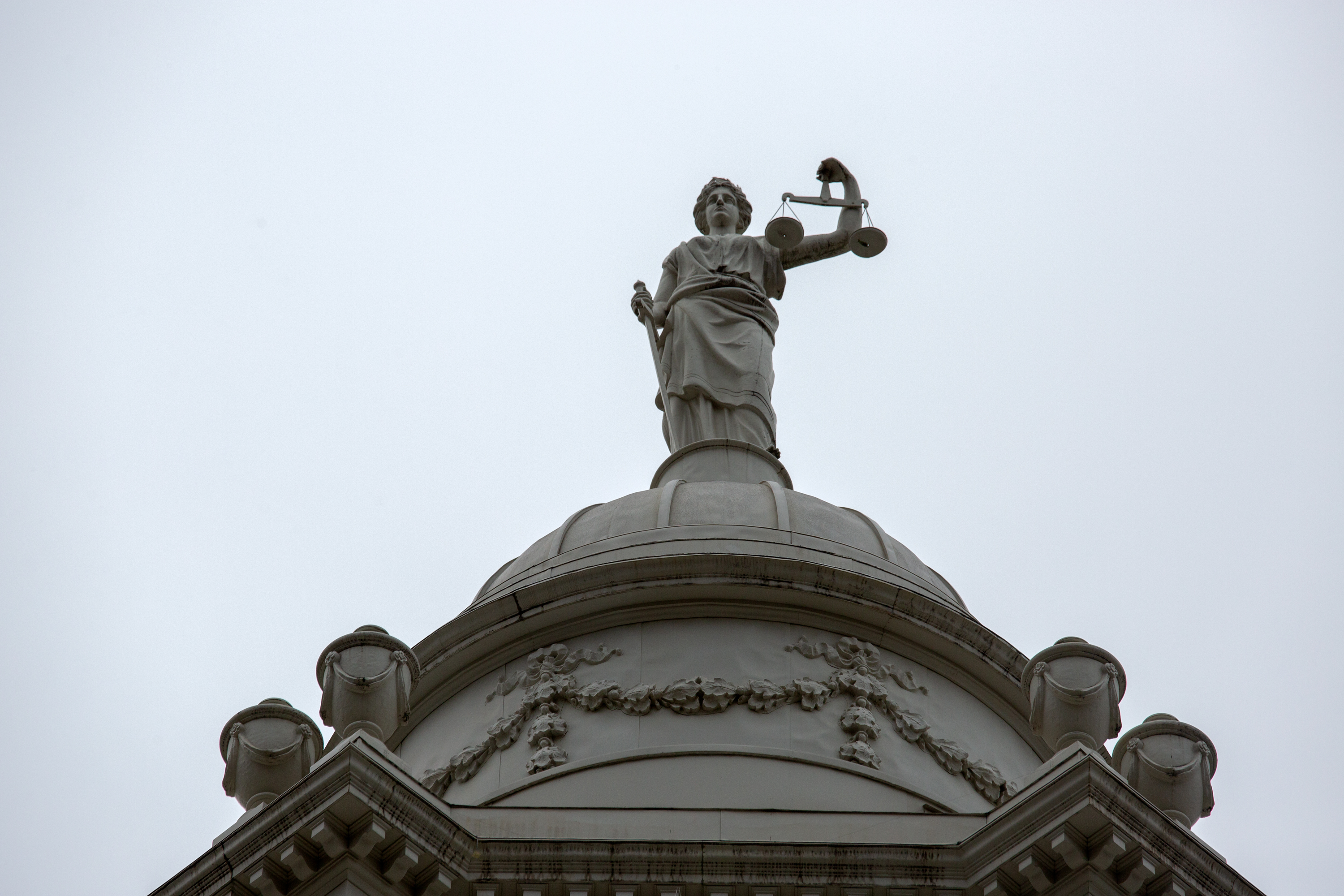 The statue of Lady Justice sits atop City Hall, Oct. 5, 2021.