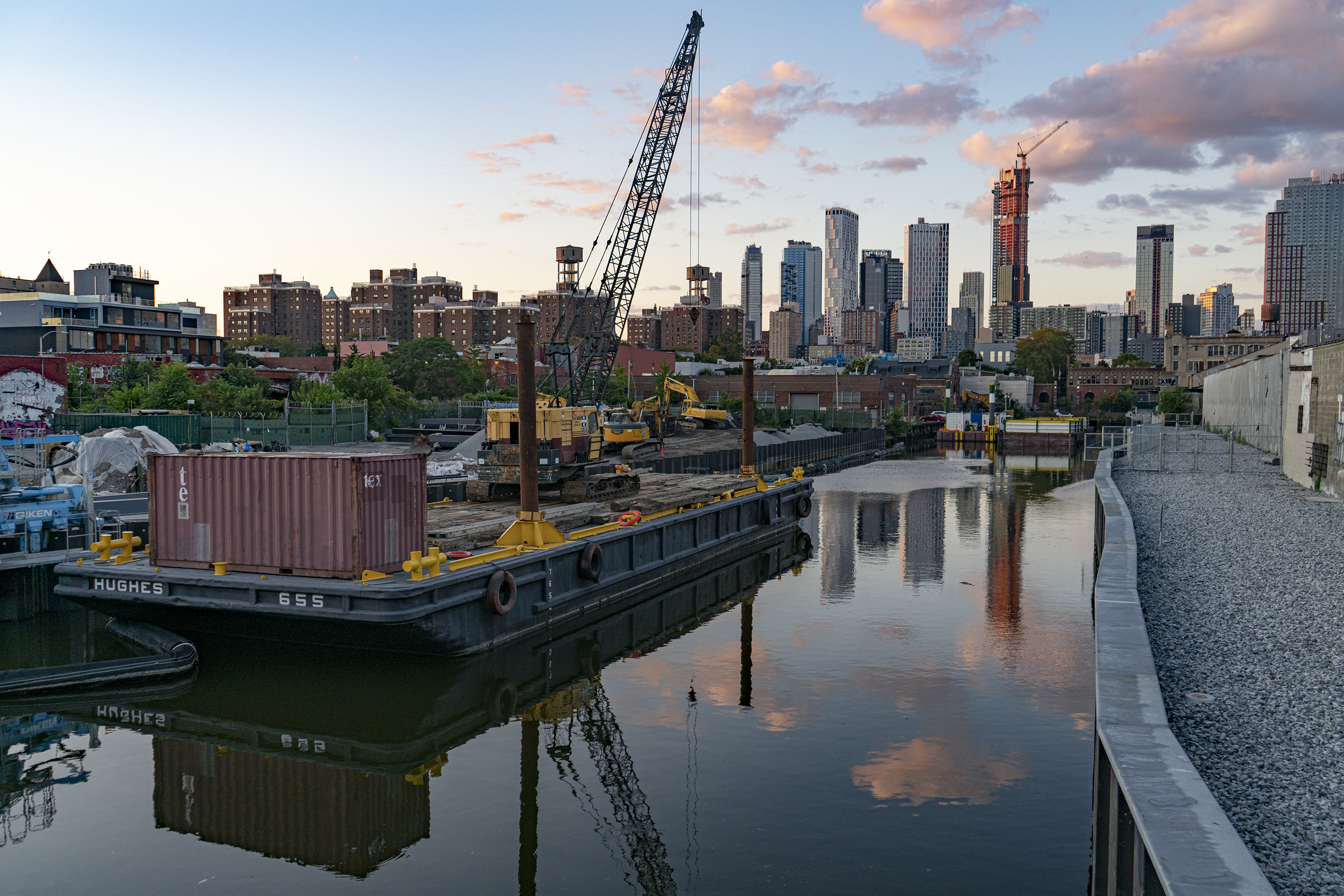 Looking north from Union St. on the Gowanus Canal. Background left are housing projects bordering the rezoning area. Background right are the luxury residences reaching skyward from Downtown Brooklyn.
