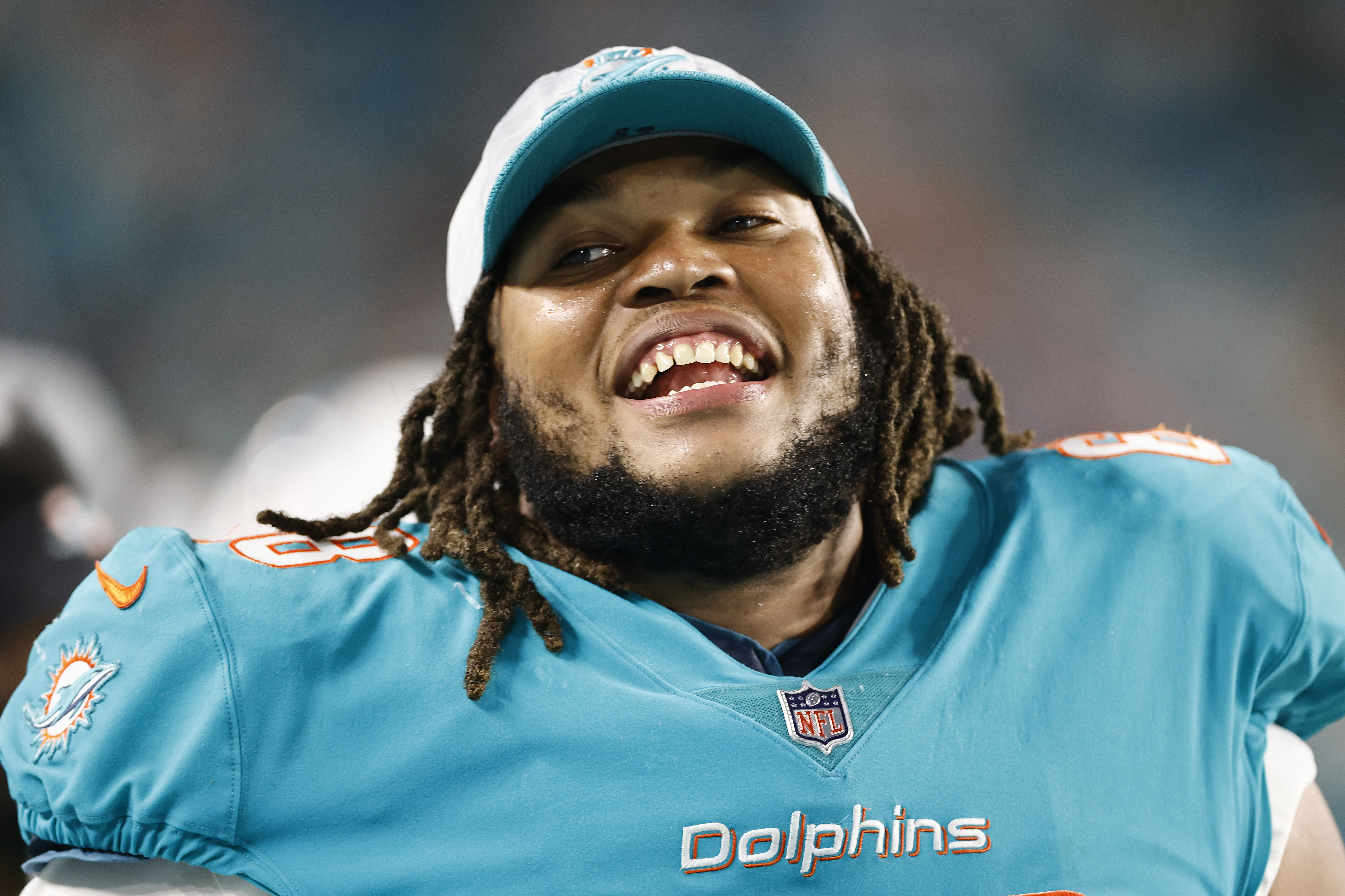 Robert Hunt #68 of the Miami Dolphins laughs against the Atlanta Falcons during a preseason game at Hard Rock Stadium on August 21, 2021 in Miami Gardens, Florida.