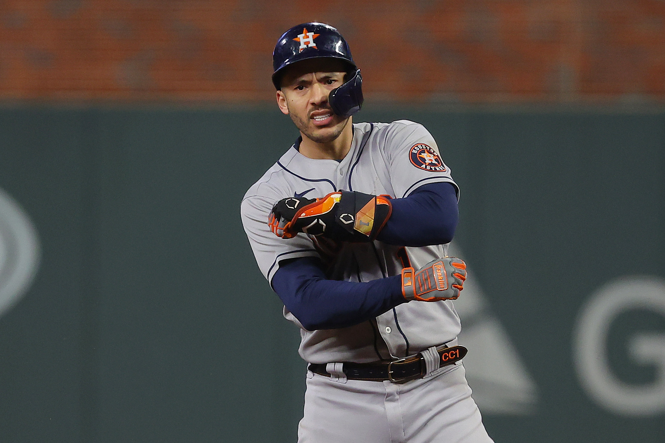 Carlos Correa #1 of the Houston Astros celebrates after hitting an RBI double against the Atlanta Braves during the third inning in Game Five of the World Series at Truist Park on October 31, 2021 in Atlanta, Georgia.