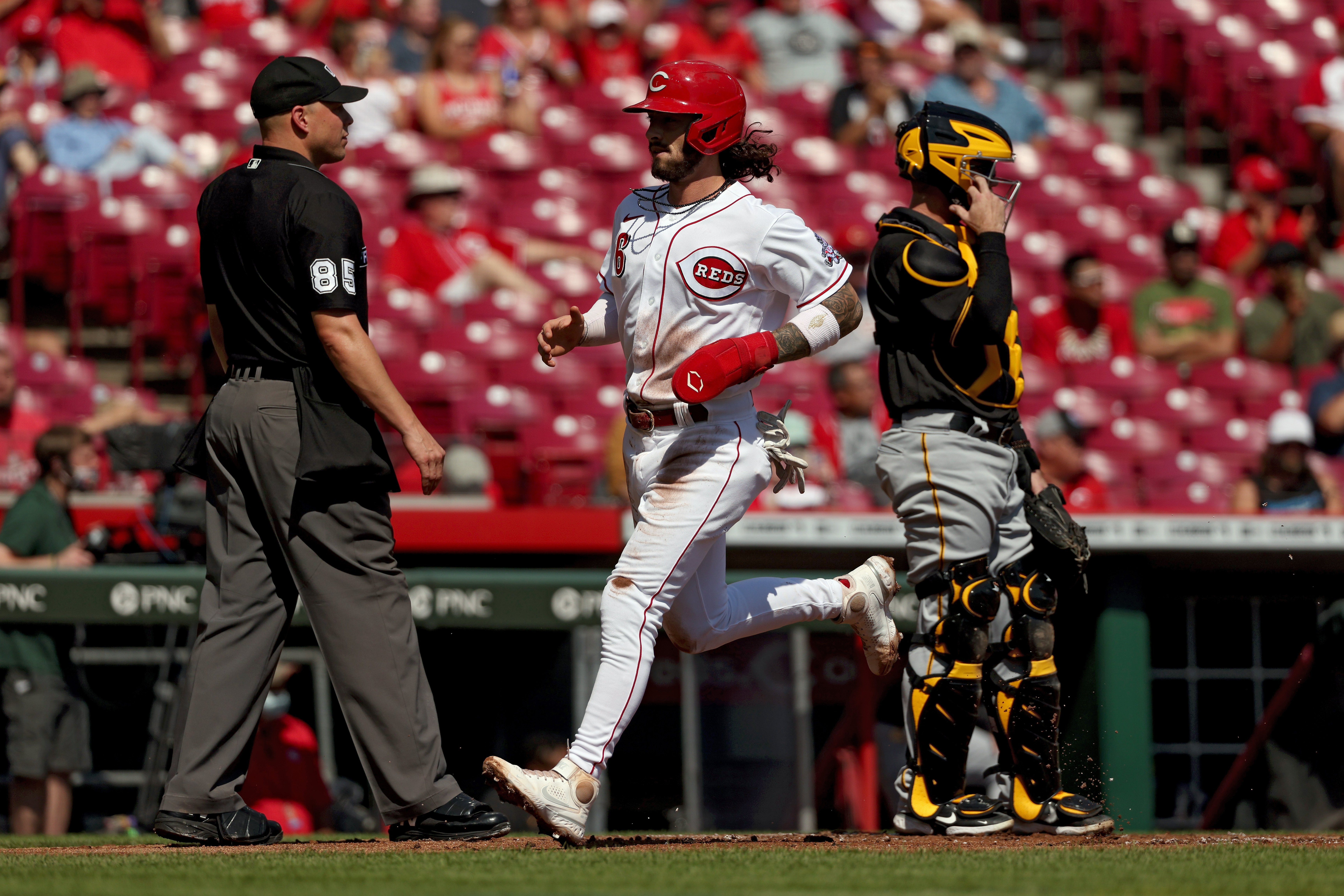 Jonathan India #6 of the Cincinnati Reds scores a run in the first inning against the Pittsburgh Pirates at Great American Ball Park on September 27, 2021 in Cincinnati, Ohio.