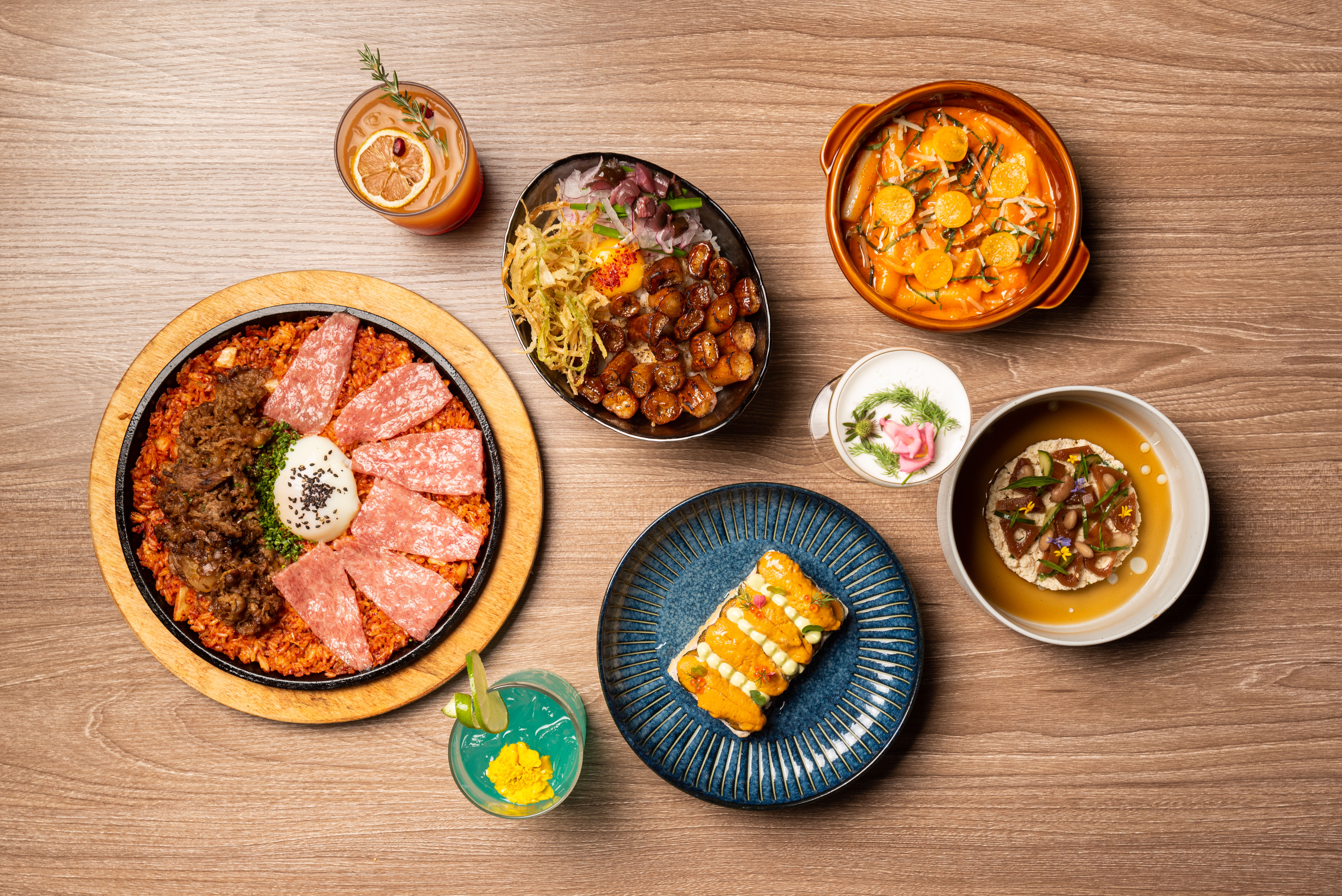 Modern Korean dishes from Tokki LA in Koreatown, like kimchi fried rice, uni toast, and crumbled tofu.