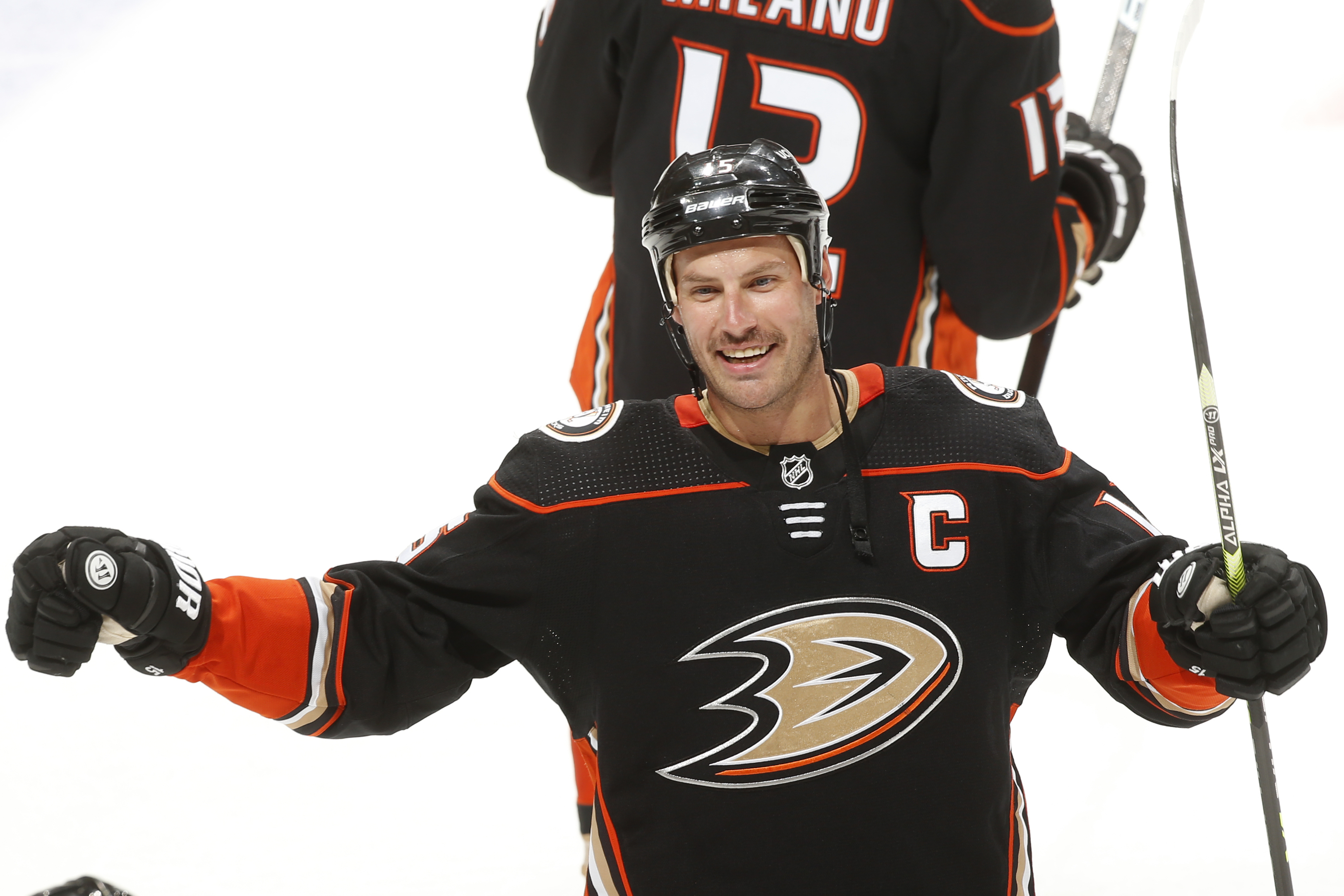 Ryan Getzlaf #15 of the Anaheim Ducks celebrates their win with teammates during overtime against the Washington Capitals on the Anaheim Ducks franchises 1,000th win and his 1,000th point at Honda Center on November 16, 2021 in Anaheim, California.