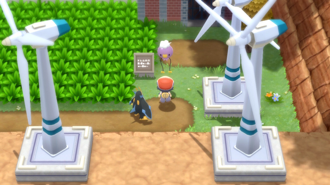 A Pokémon trainer stands in front of a lone Drifloon at the Valley Windworks