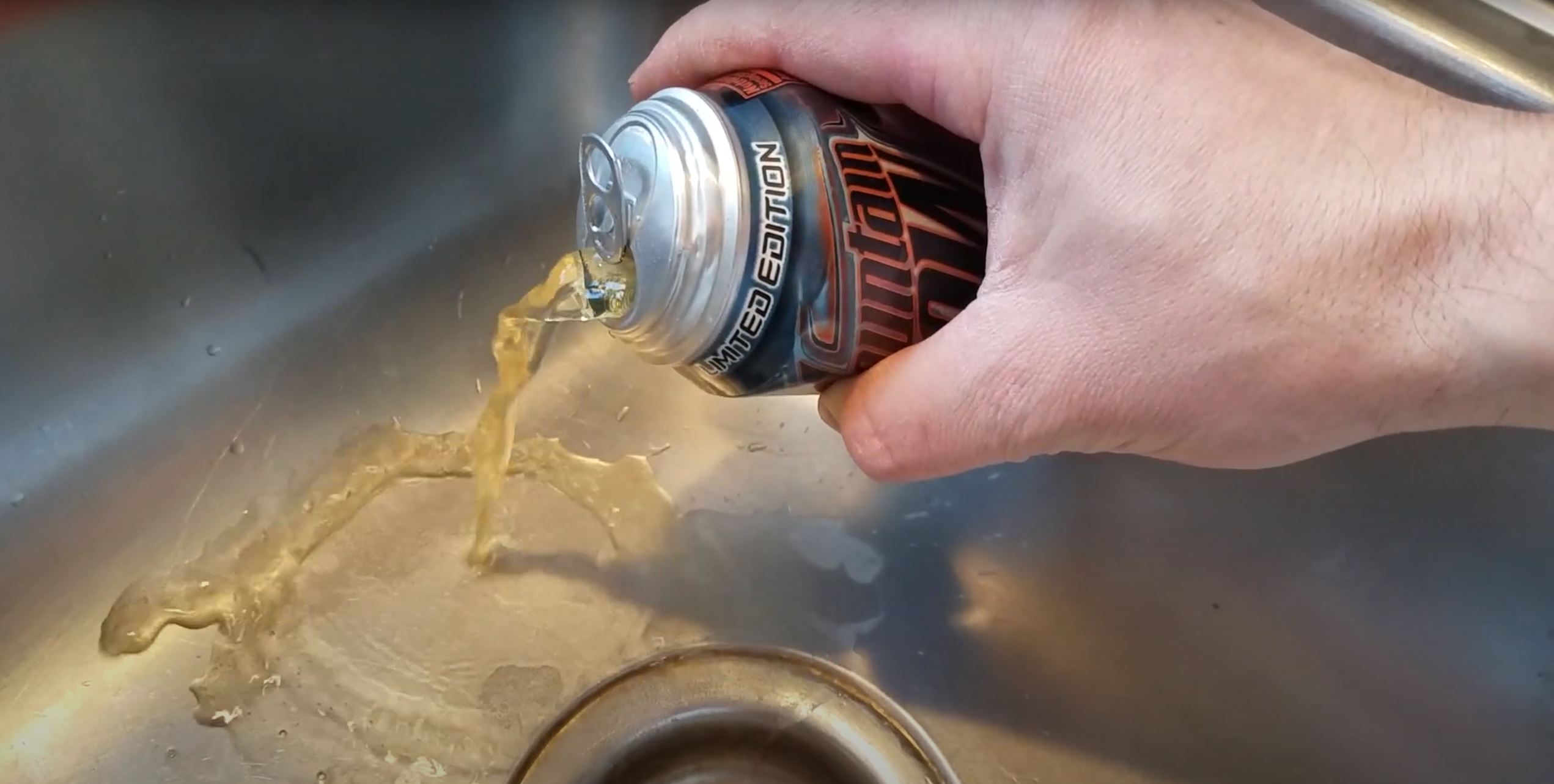 YouTube user xKorellx pours a can of Game Fuel down the sink