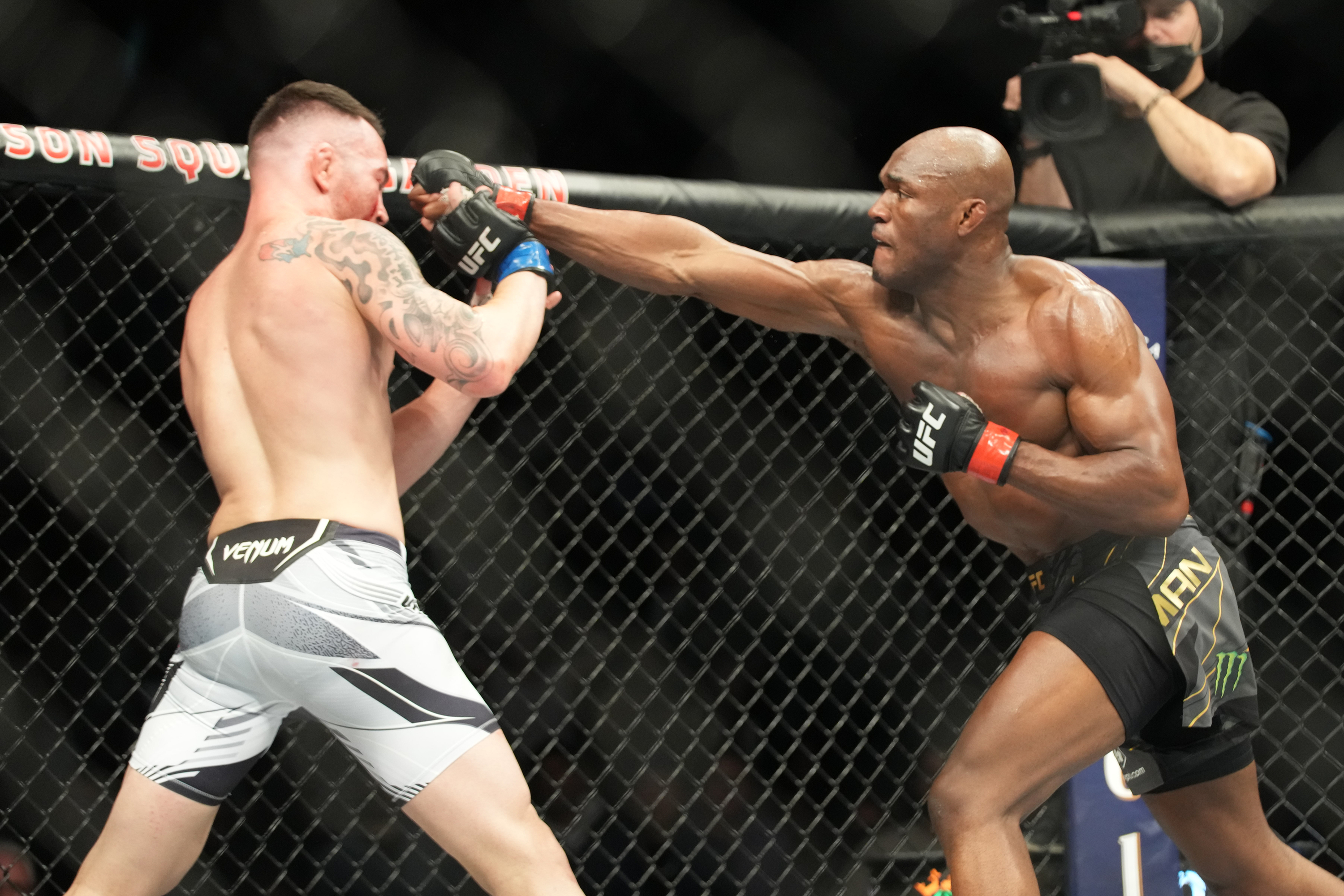 Kamaru Usman punches Colby Covington at UFC 268.