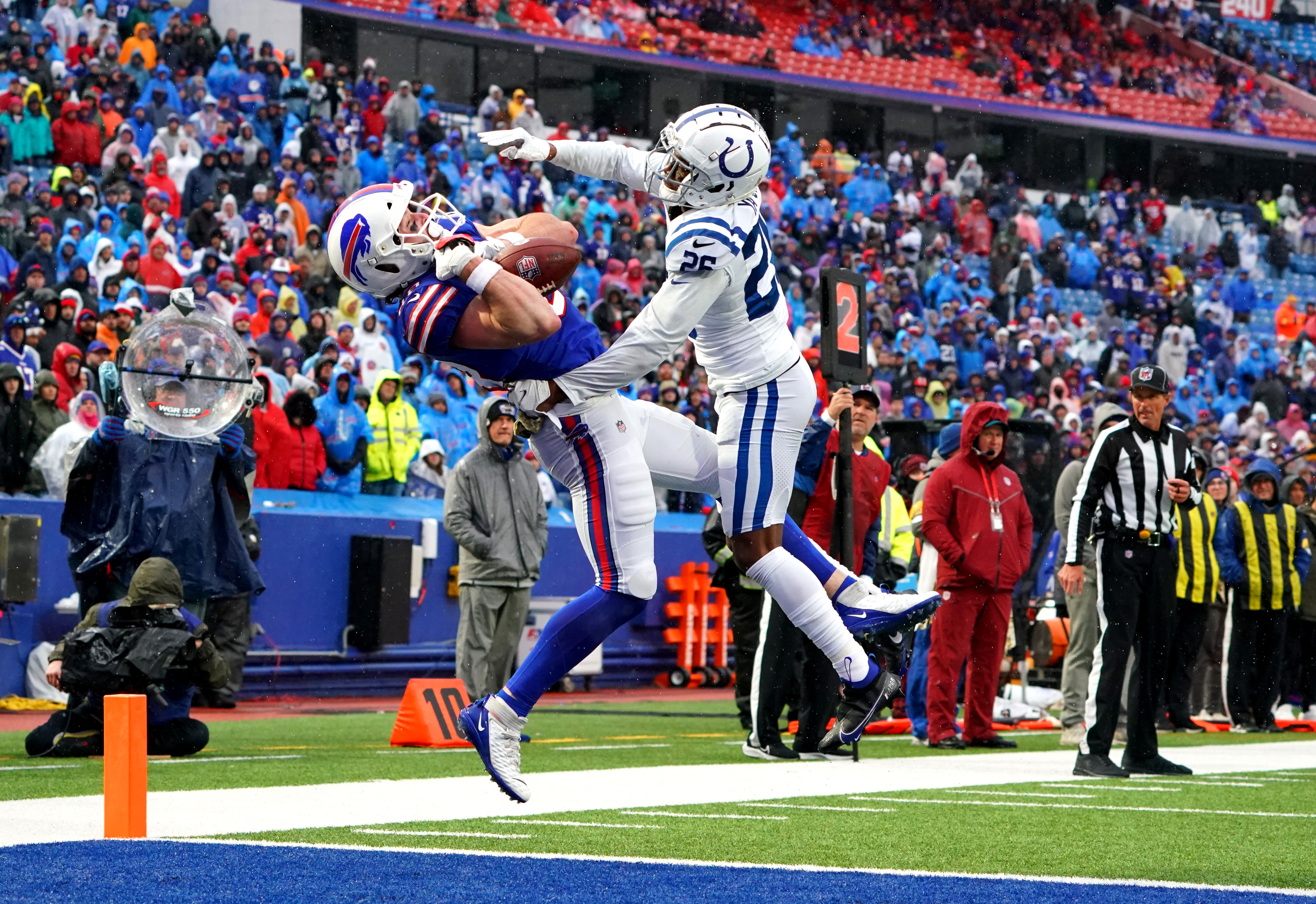 Dawson Knox #88 of the Buffalo Bills attempts to catch a pass that is broken up by Rock Ya-Sin #26 of the Indianapolis Colts during the fourth quarter at Highmark Stadium on November 21, 2021 in Orchard Park, New York.