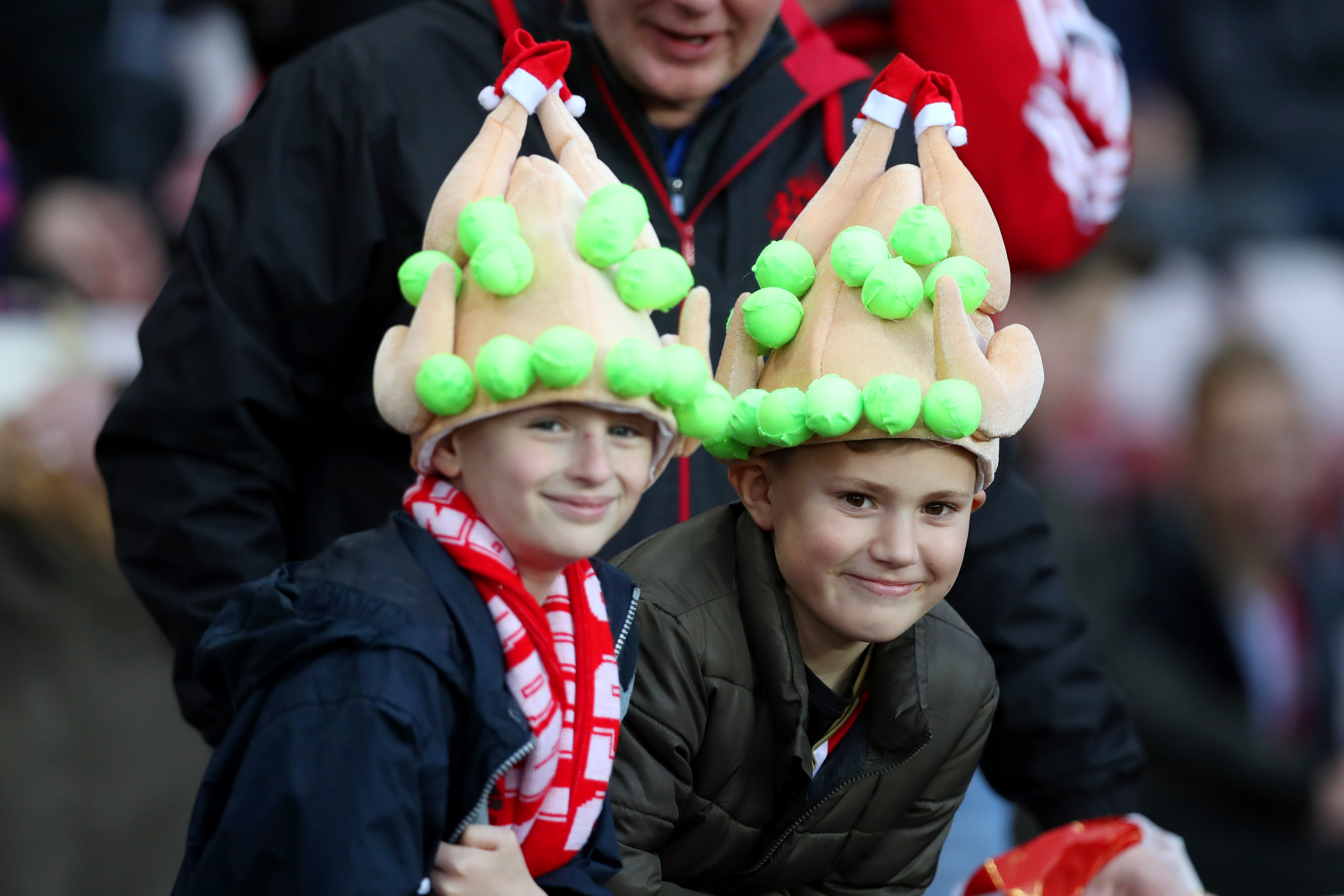 Two young fans wearing turkey-hats - Premier League