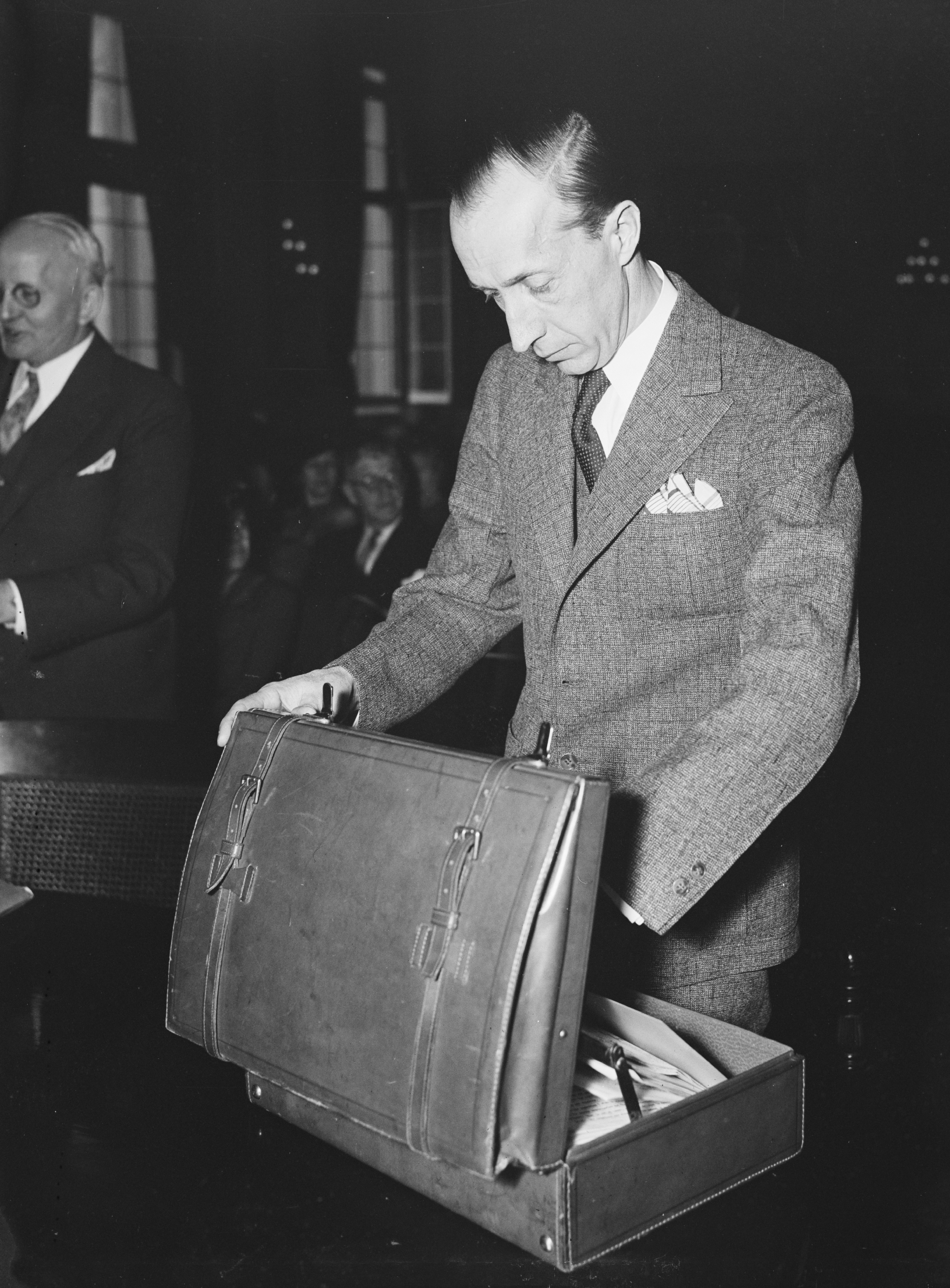 1930s Man looking through his briefcase ca. 1936