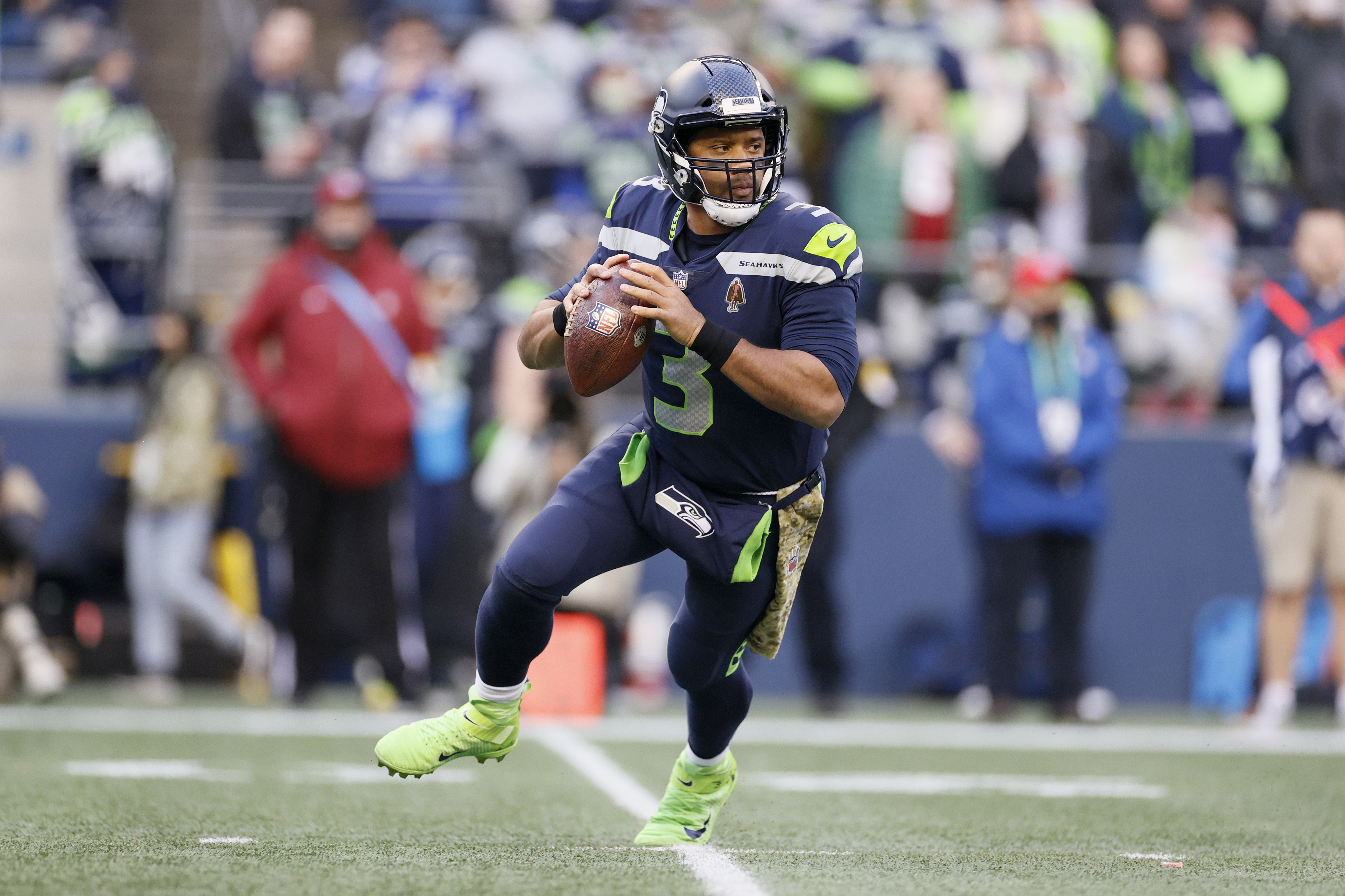 Russell Wilson #3 of the Seattle Seahawks looks to pass against the Arizona Cardinals during the second half at Lumen Field on November 21, 2021 in Seattle, Washington.