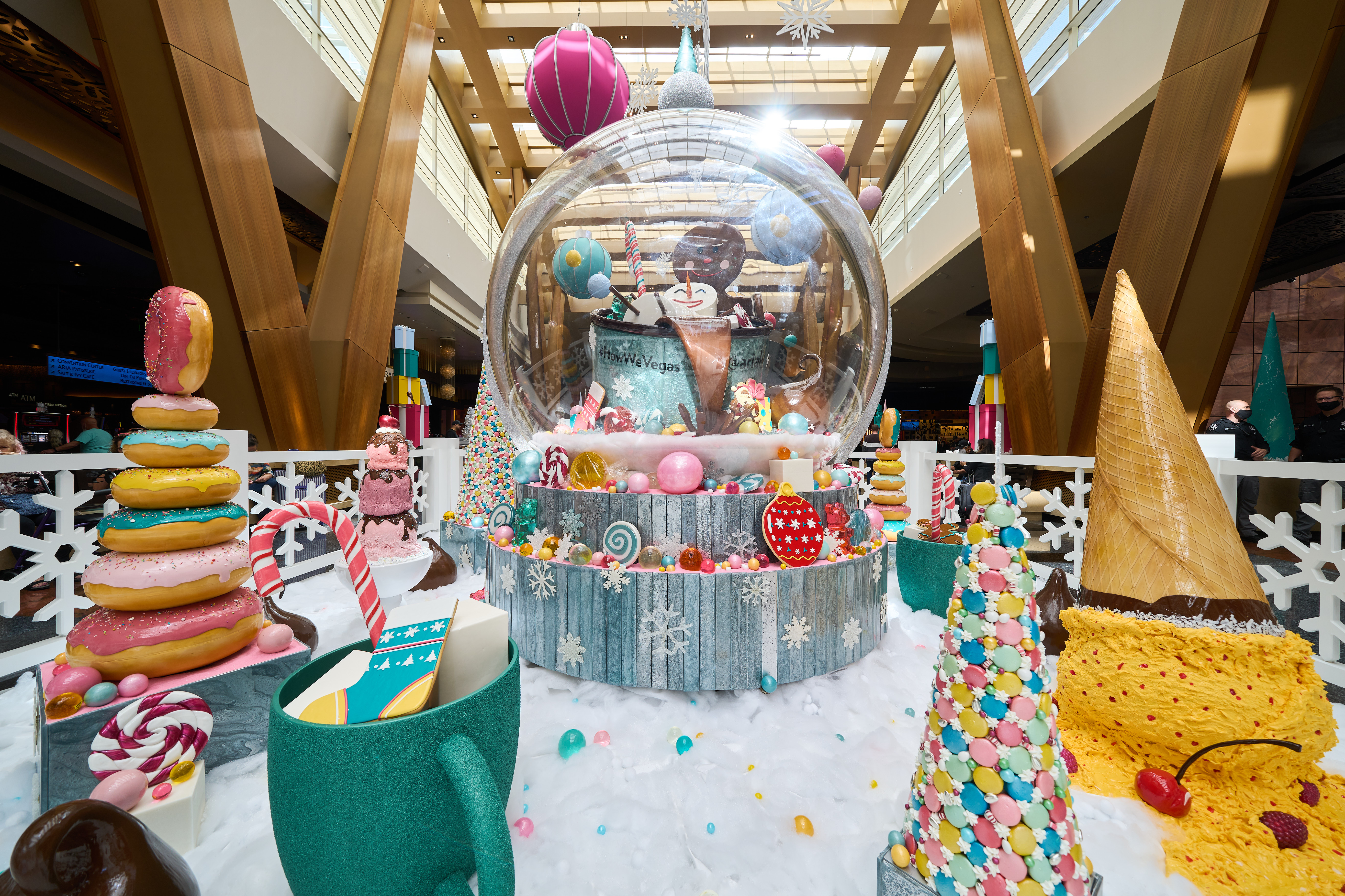 A holiday display with a giant snow globe.