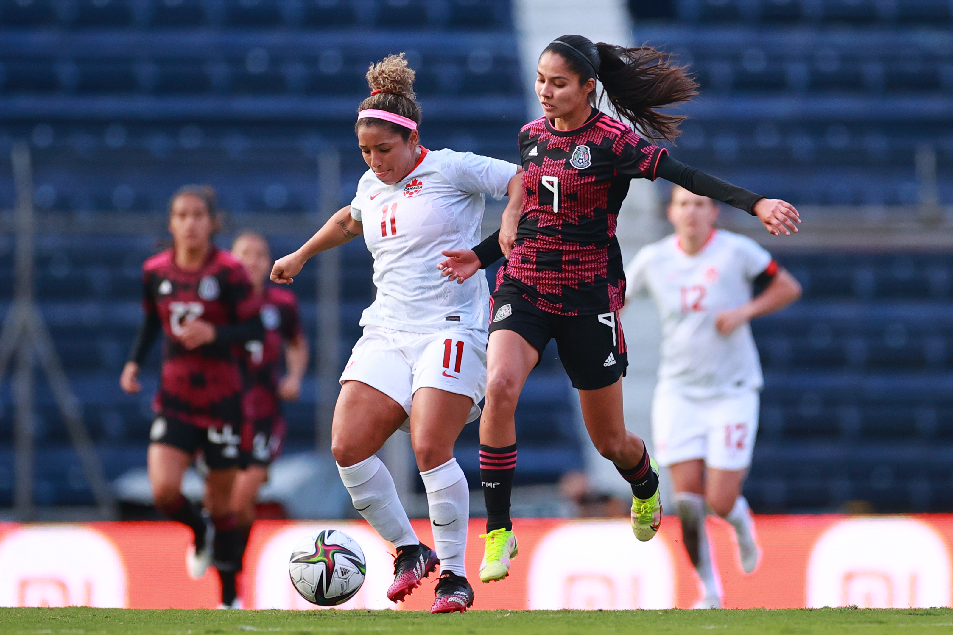 Desiree Scott of Canada battles for possession with Alison Gonzalez of Mexico during the Women’s International Friendly between Mexico and Canada at Estadio Ciudad de los Deportes on November 30, 2021 in Mexico City, Mexico.