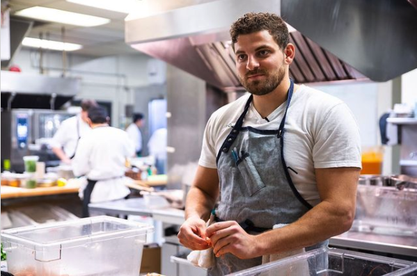 Nostalgia and Herbal Chef owner Chris Sayegh in an industrial kitchen.