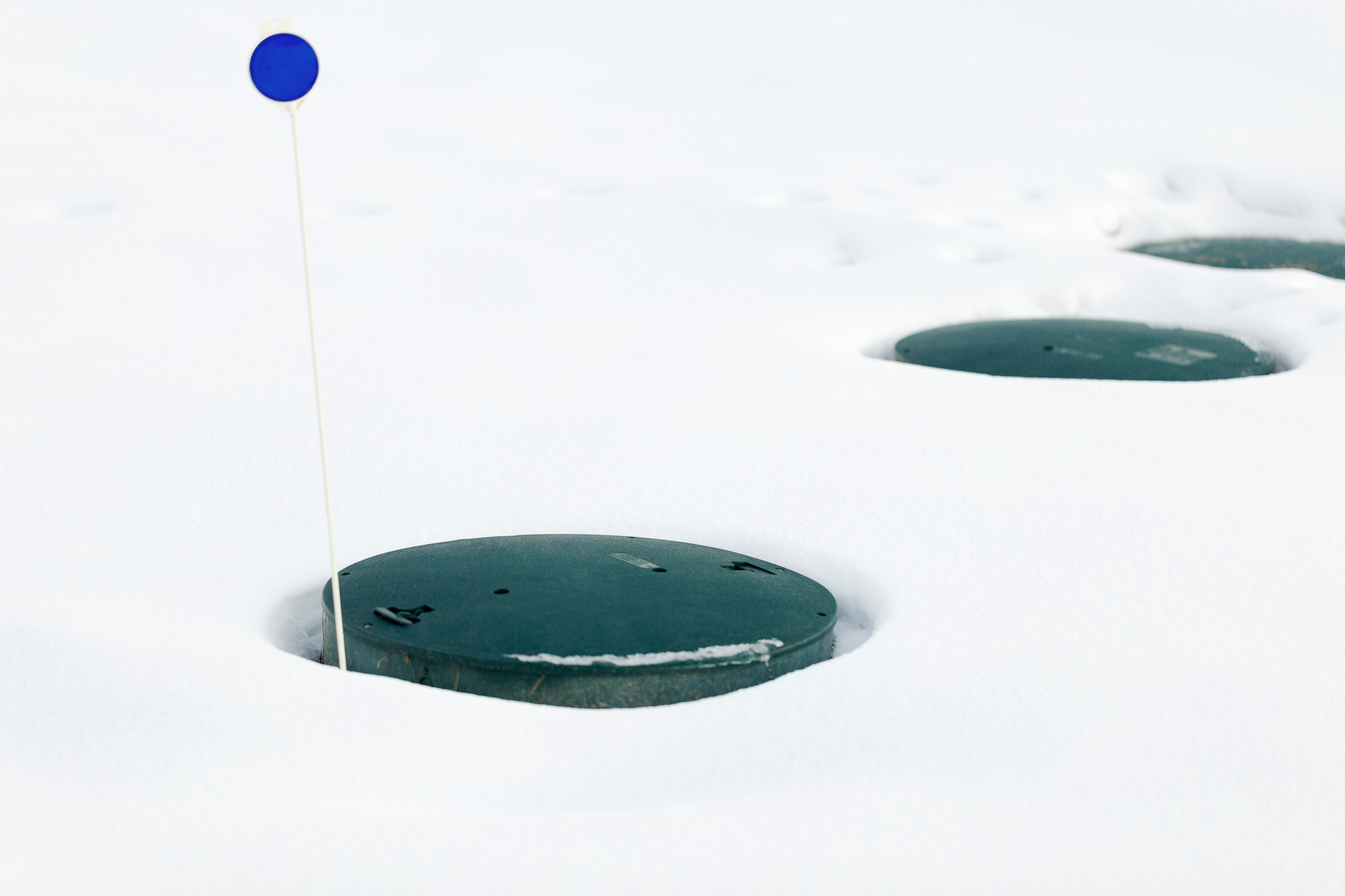 Septic Tank lids sticking out of snow.